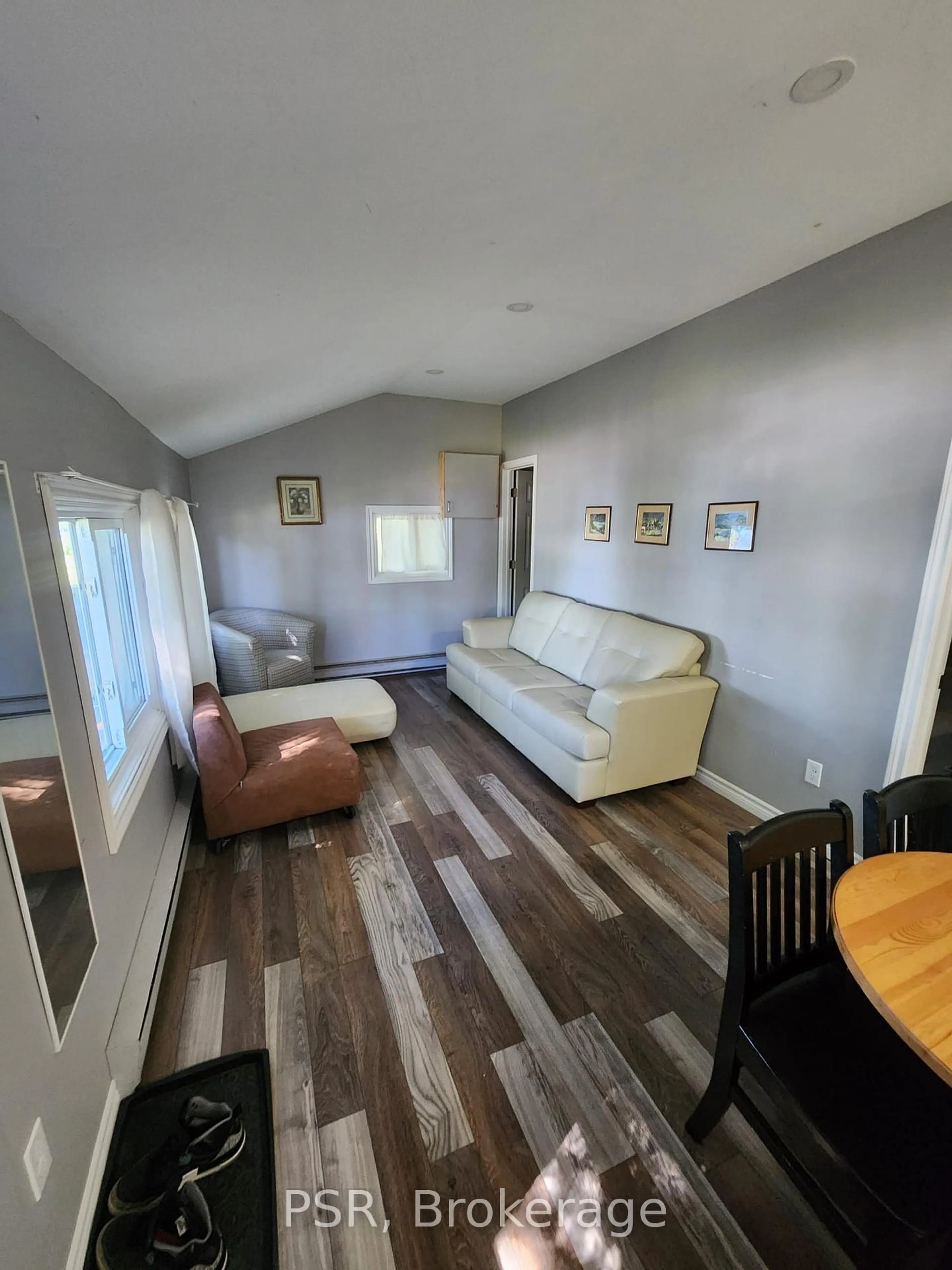 Living room with furniture, wood/laminate floor for 232 Lake Dalrymple Rd #10, Kawartha Lakes Ontario L0K 1W0