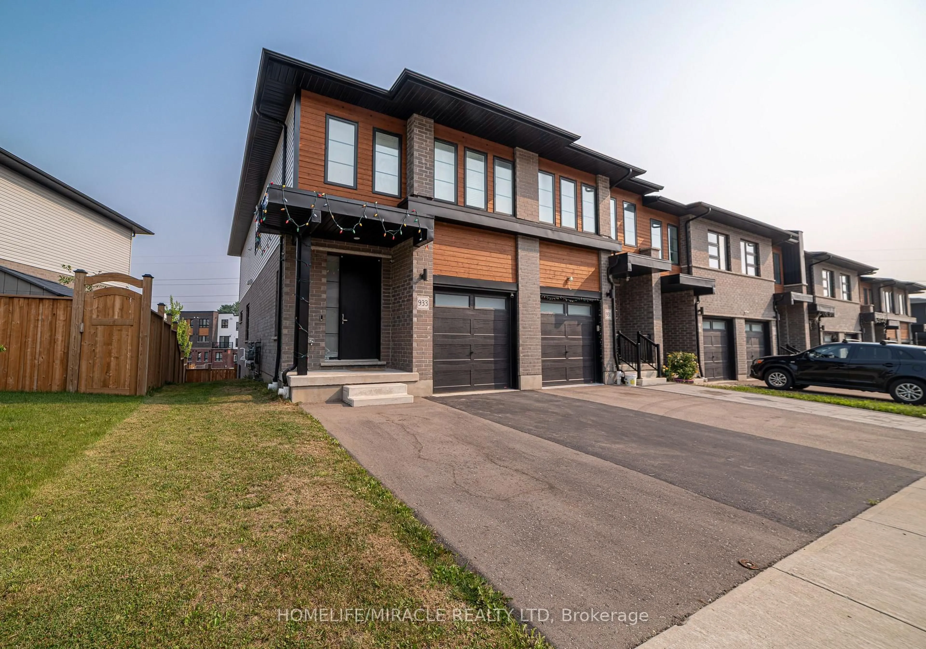 Home with brick exterior material, street for 933 Robert Ferrie Dr, Kitchener Ontario N2R 0P9