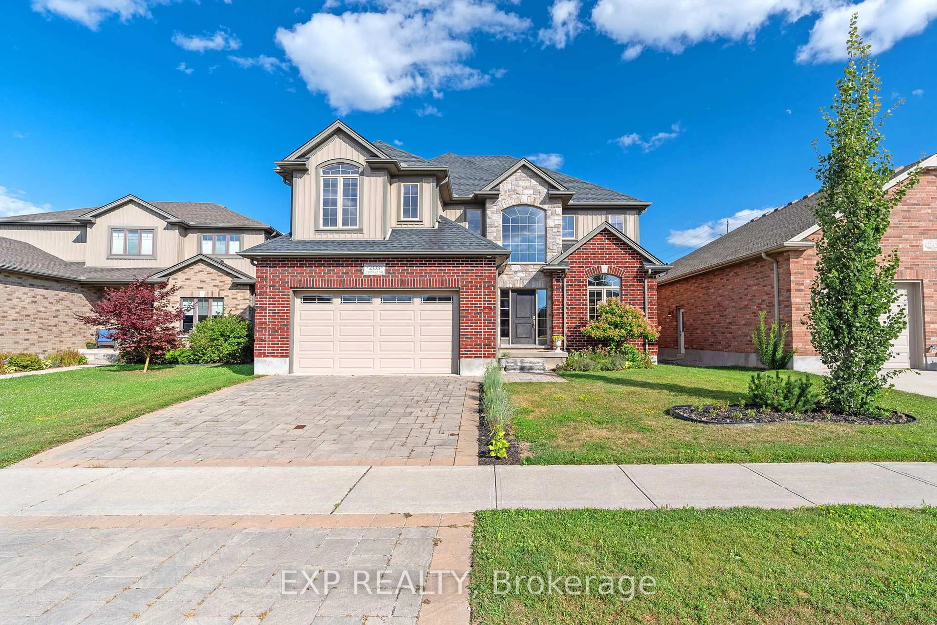Home with brick exterior material, street for 203 Campanale Way, Lucan Biddulph Ontario N0M 2J0