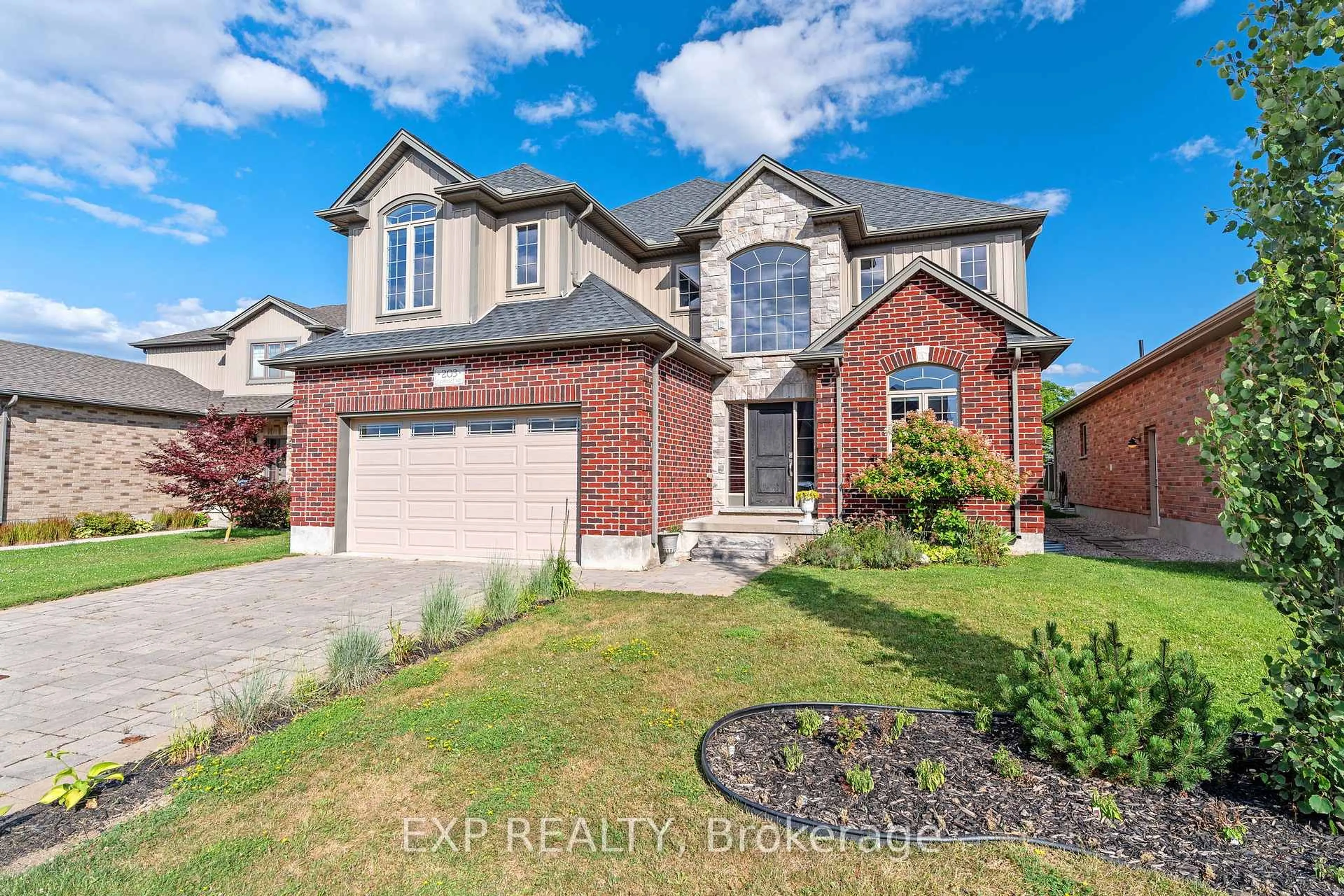 Home with brick exterior material, street for 203 Campanale Way, Lucan Biddulph Ontario N0M 2J0