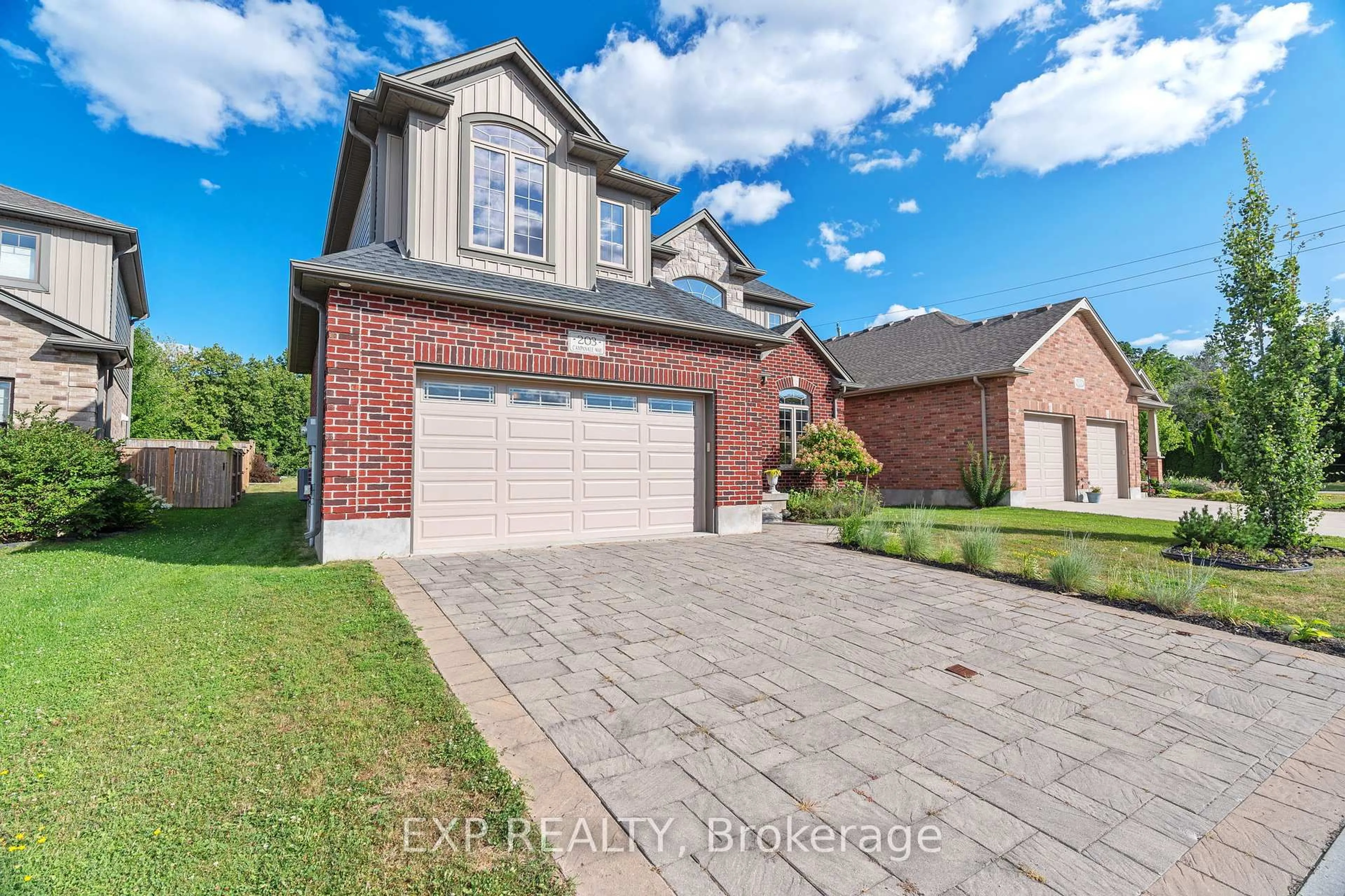 Home with brick exterior material, street for 203 Campanale Way, Lucan Biddulph Ontario N0M 2J0