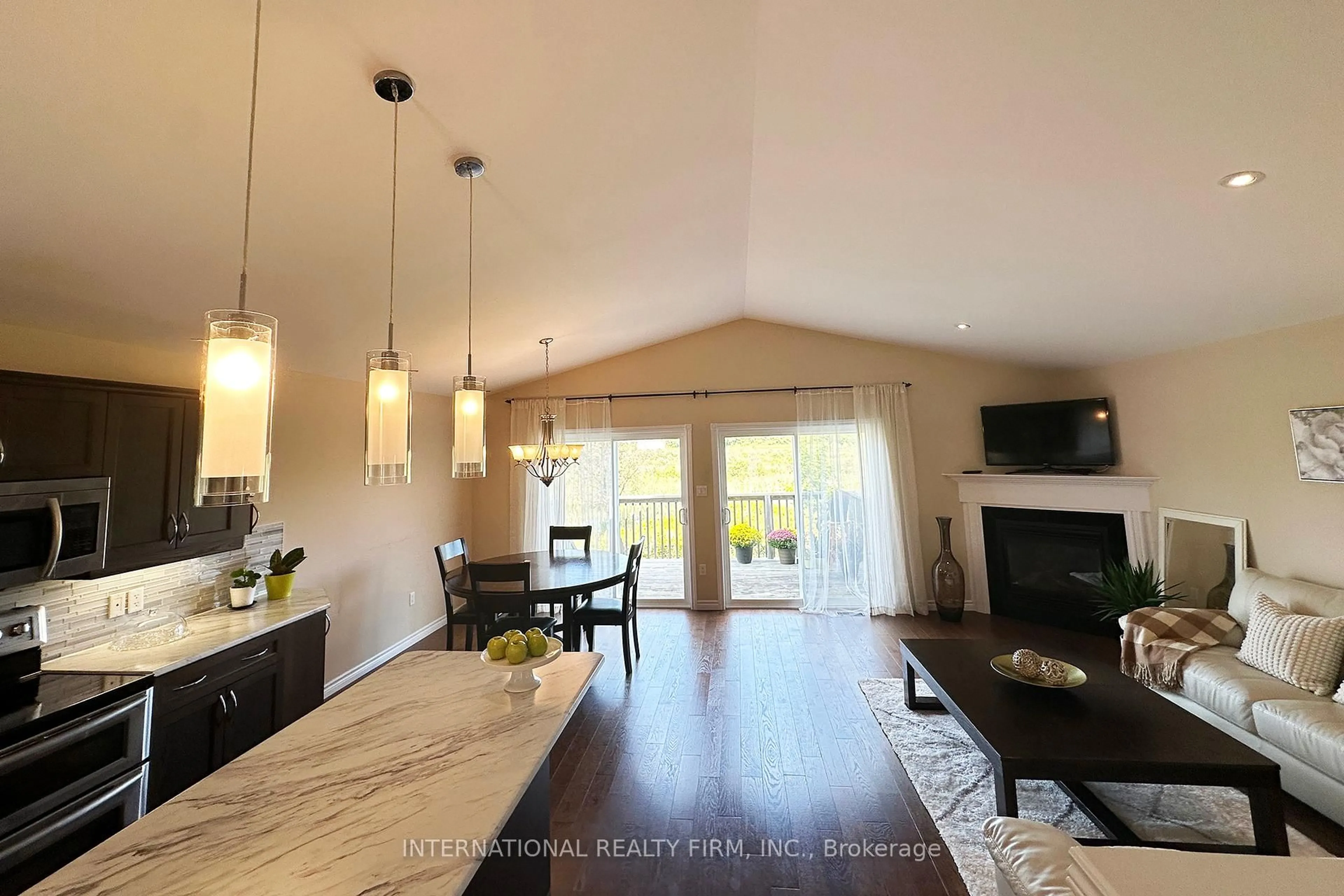 Open concept kitchen, wood/laminate floor for 1453 Ireland Dr, Peterborough West Ontario K9K 0A4