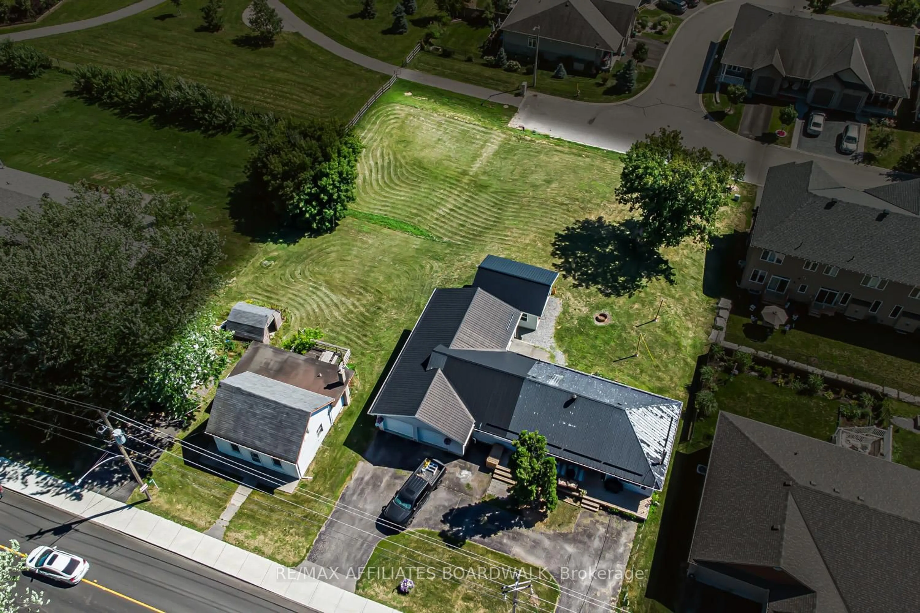 A pic from outside/outdoor area/front of a property/back of a property/a pic from drone, street for 303-307 DONALD B MUNRO Dr, Carp Ontario K0A 1L0