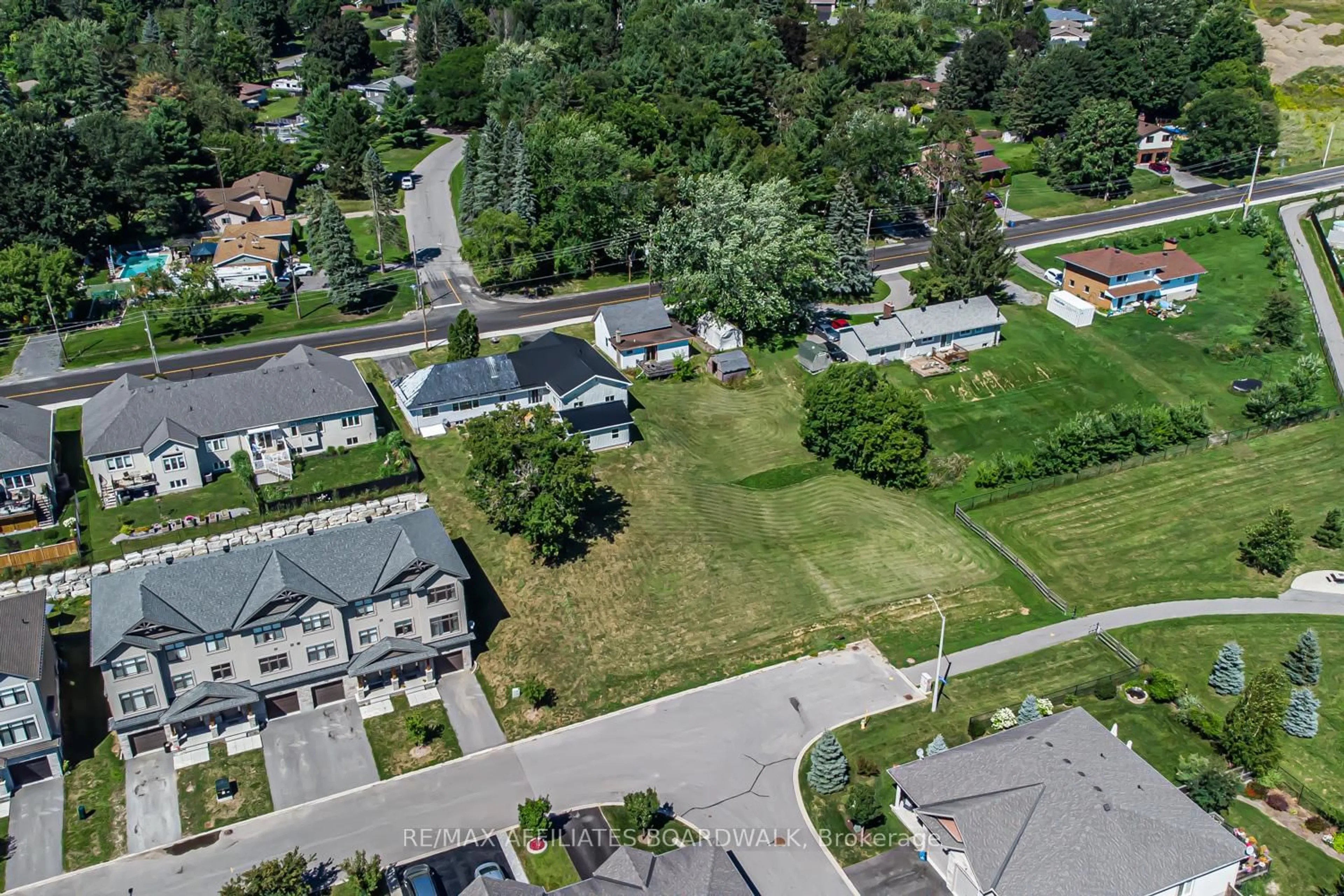 A pic from outside/outdoor area/front of a property/back of a property/a pic from drone, street for 303-307 DONALD B MUNRO Dr, Carp Ontario K0A 1L0