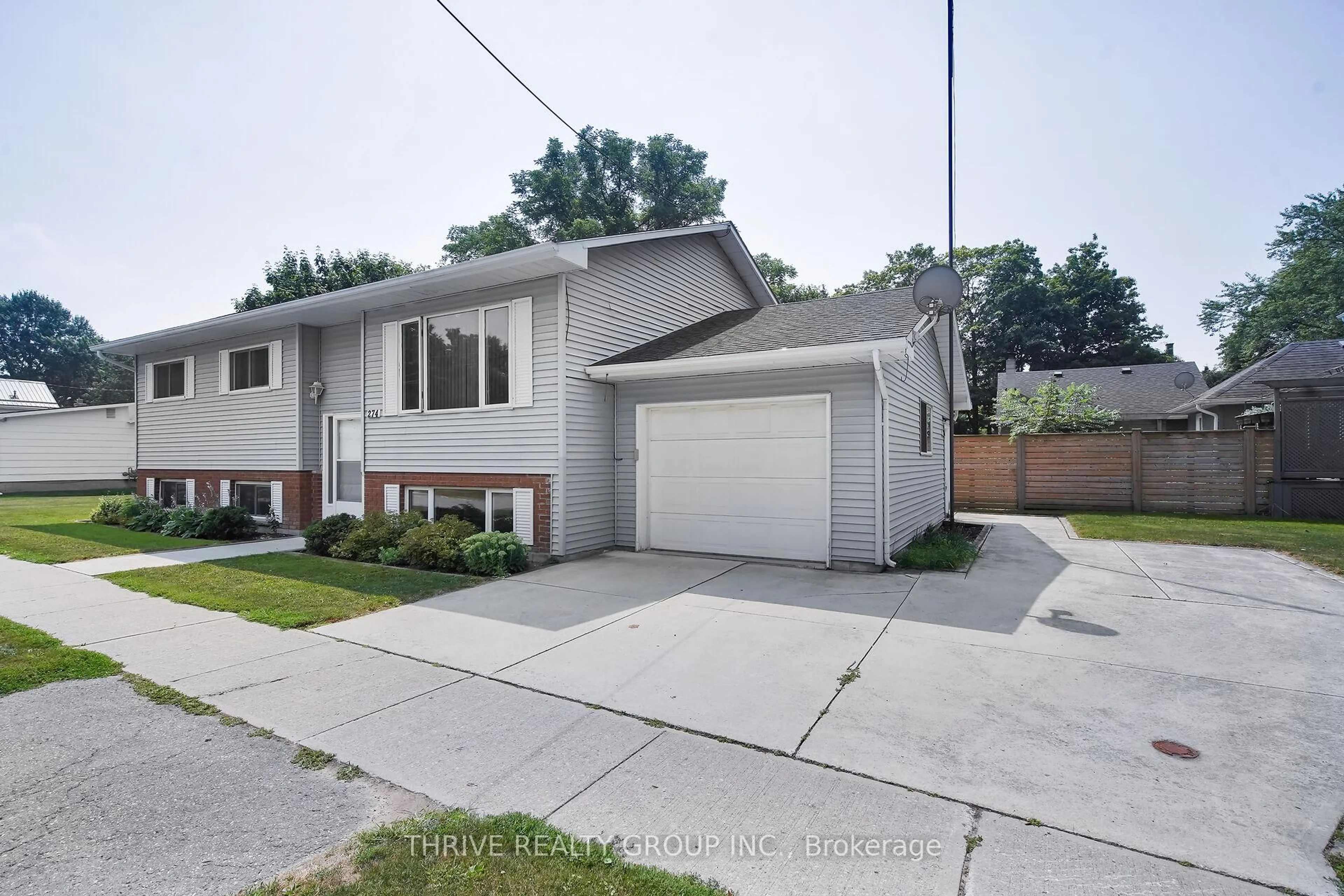 Home with brick exterior material, street for 274 Station St, North Middlesex Ontario N0M 2K0