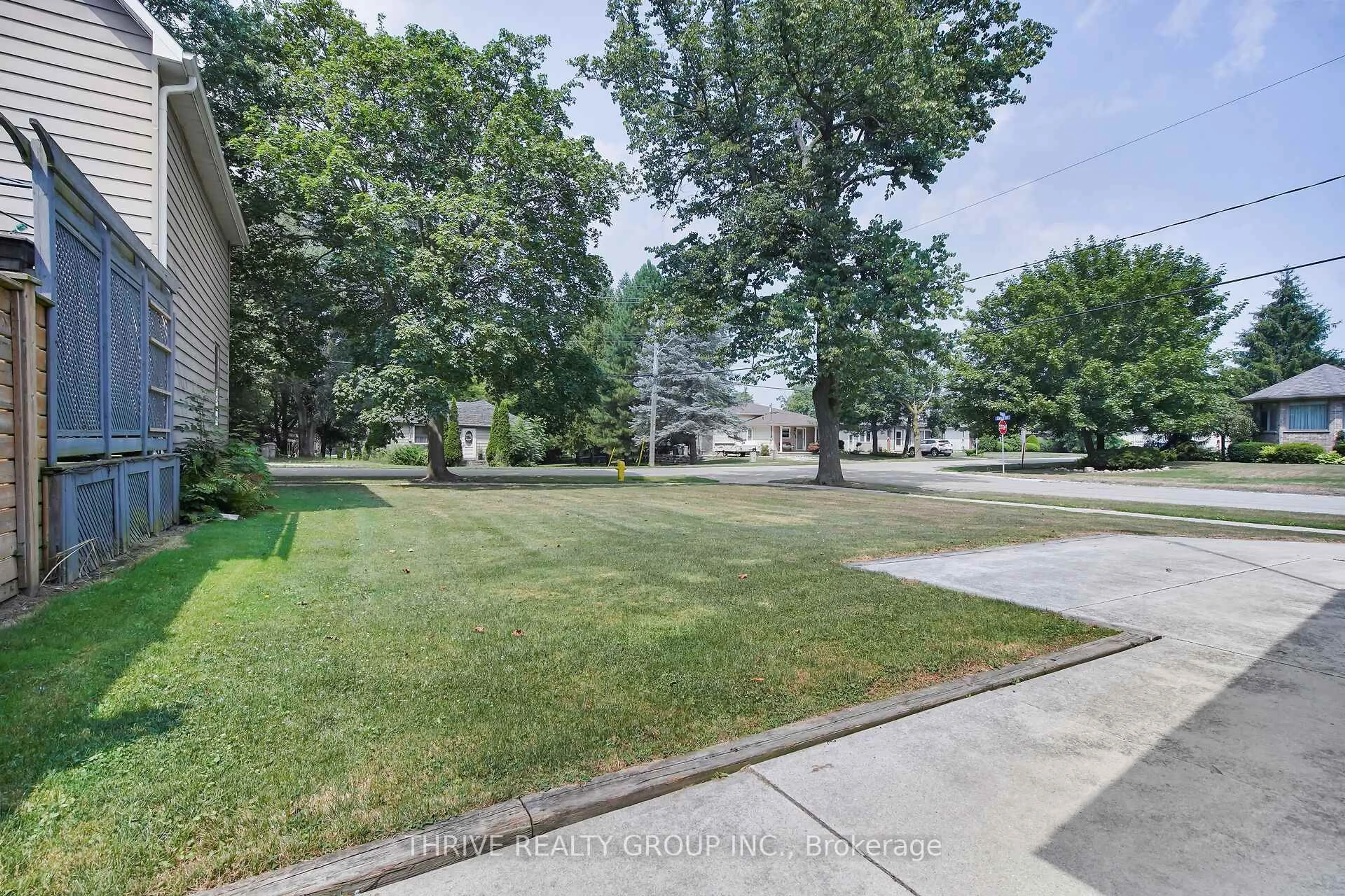 A pic from outside/outdoor area/front of a property/back of a property/a pic from drone, street for 274 Station St, North Middlesex Ontario N0M 2K0