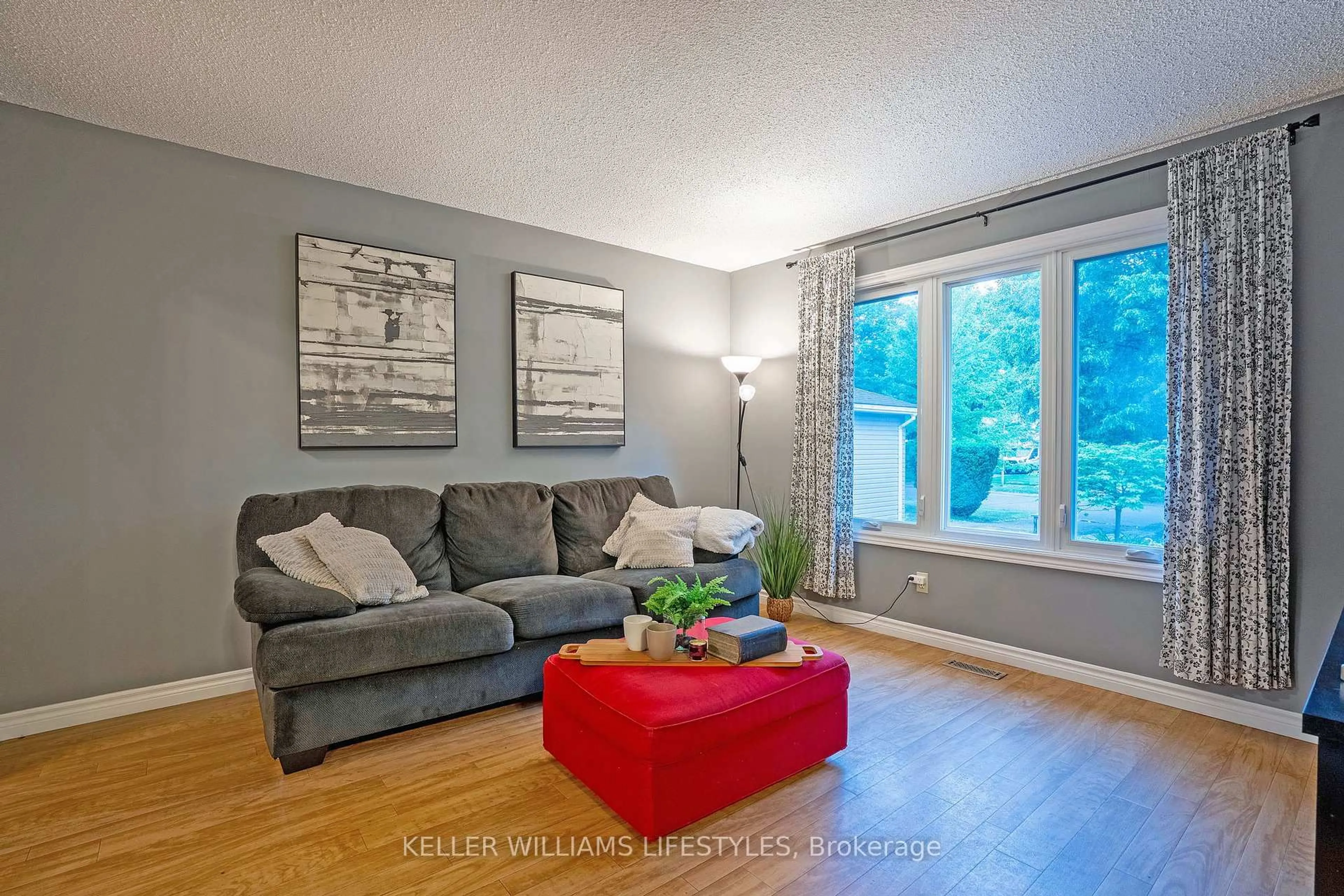 Living room with furniture, wood/laminate floor for 21 Beechbank Cres, London South Ontario N6E 2N9