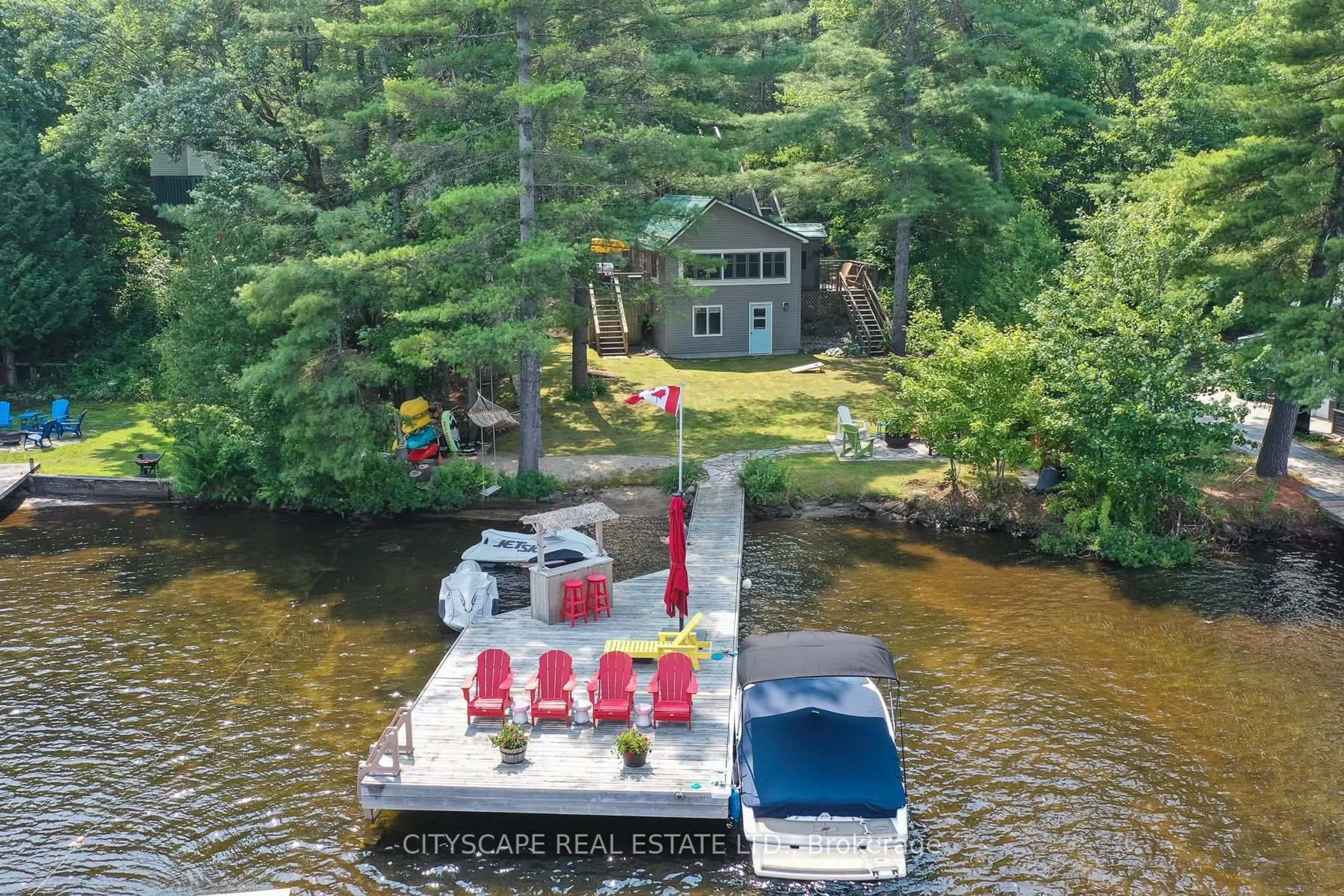 A pic from outside/outdoor area/front of a property/back of a property/a pic from drone, water/lake/river/ocean view for 1100 Hewitt St #2, Gravenhurst Ontario P1P 1R3