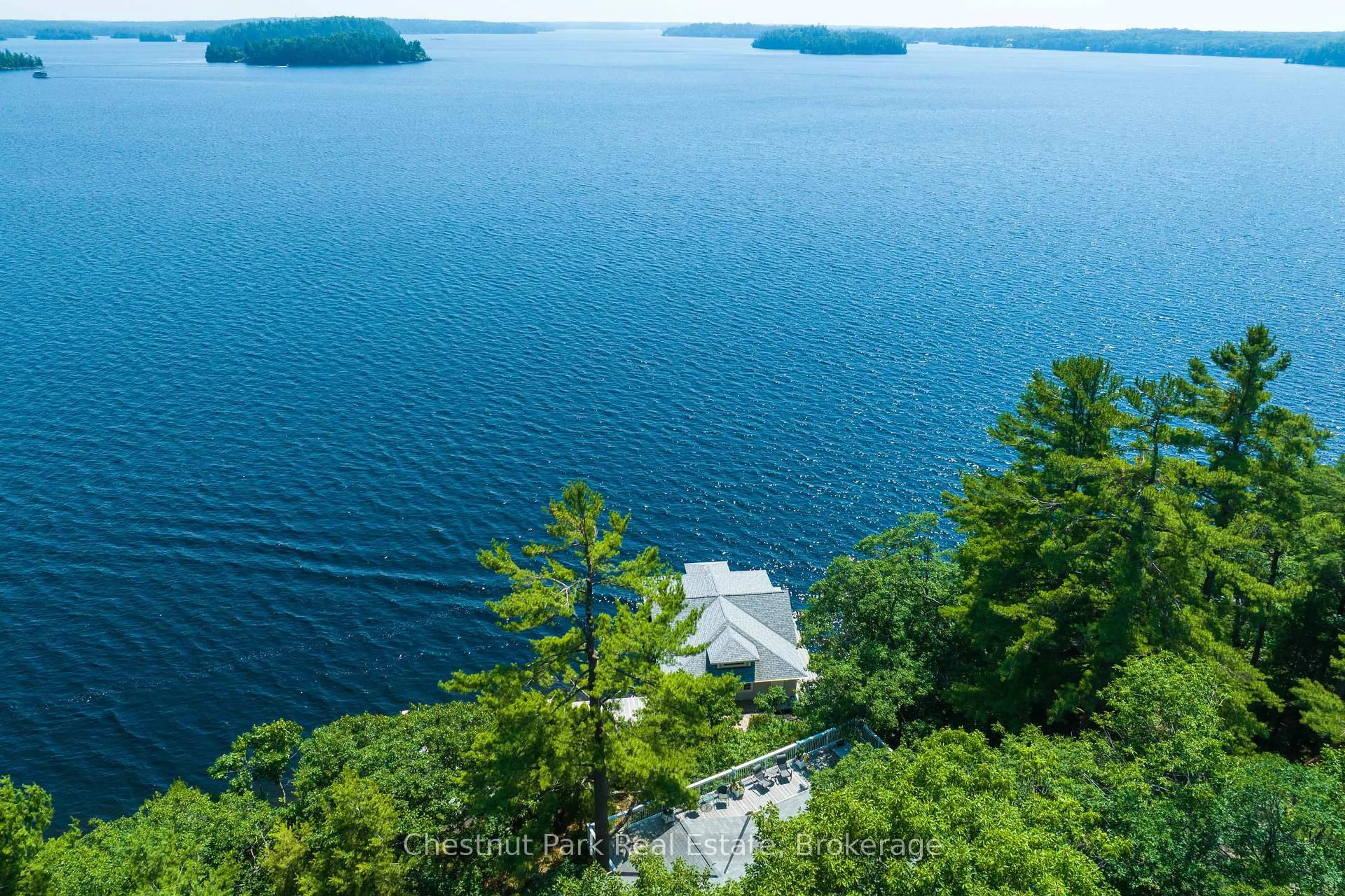 A pic from outside/outdoor area/front of a property/back of a property/a pic from drone, water/lake/river/ocean view for 1121 Scarcliffe Rd #14, Muskoka Lakes Ontario P0B 1J0