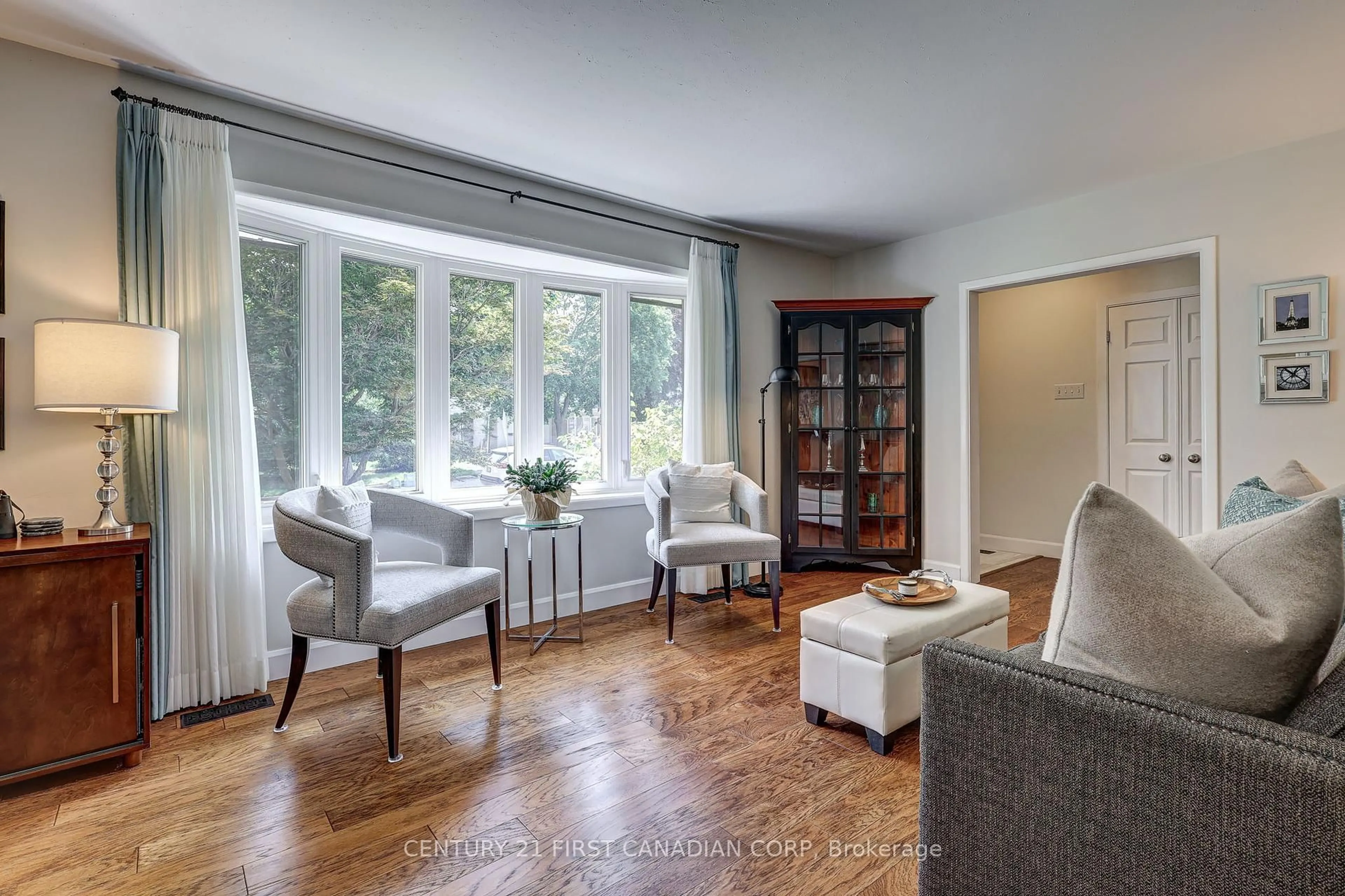 Living room with furniture, wood/laminate floor for 611 Chiddington Ave, London South Ontario N6C 2W6