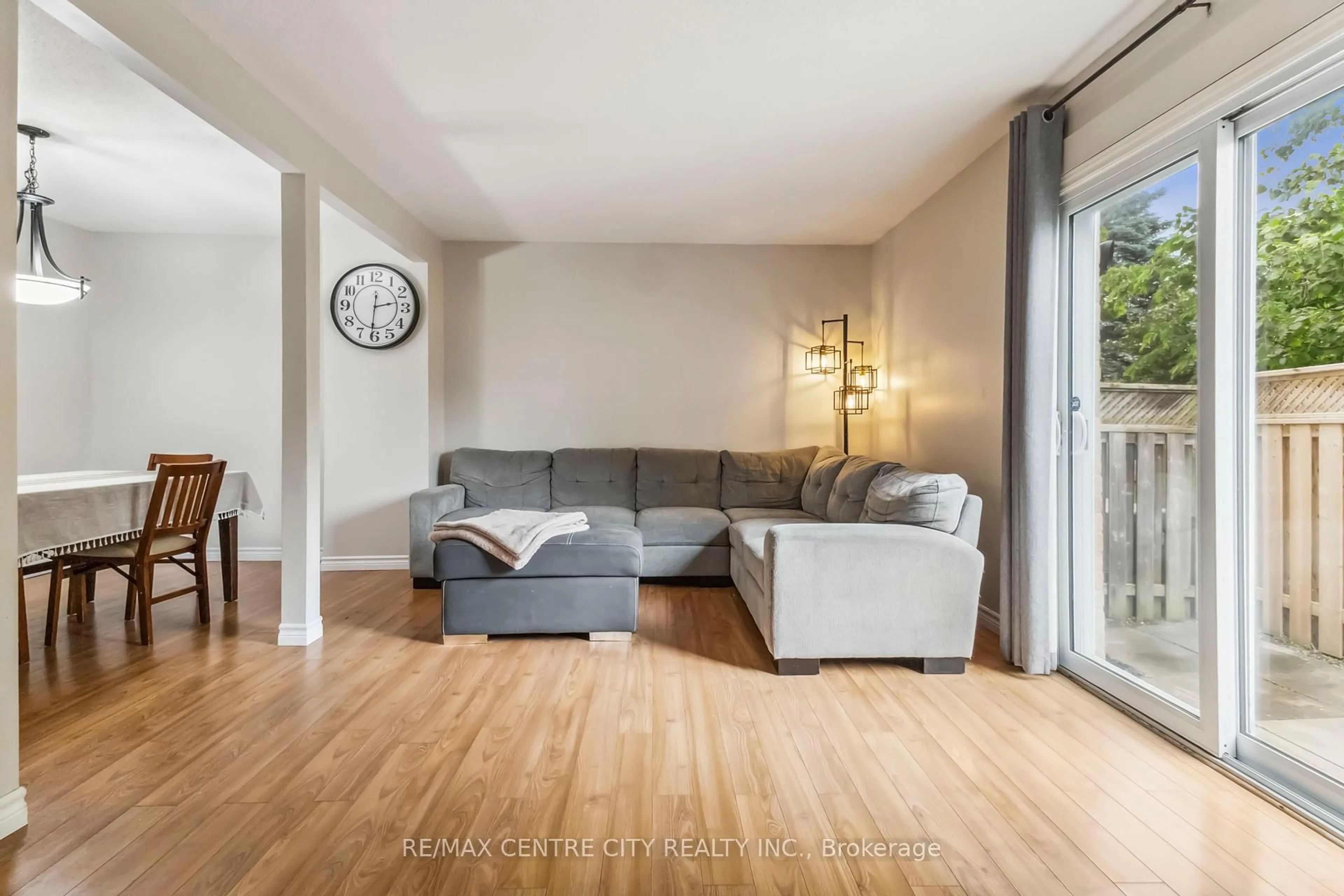 Living room with furniture, wood/laminate floor for 720 Deveron Cres #26, London South Ontario N5Z 4W6