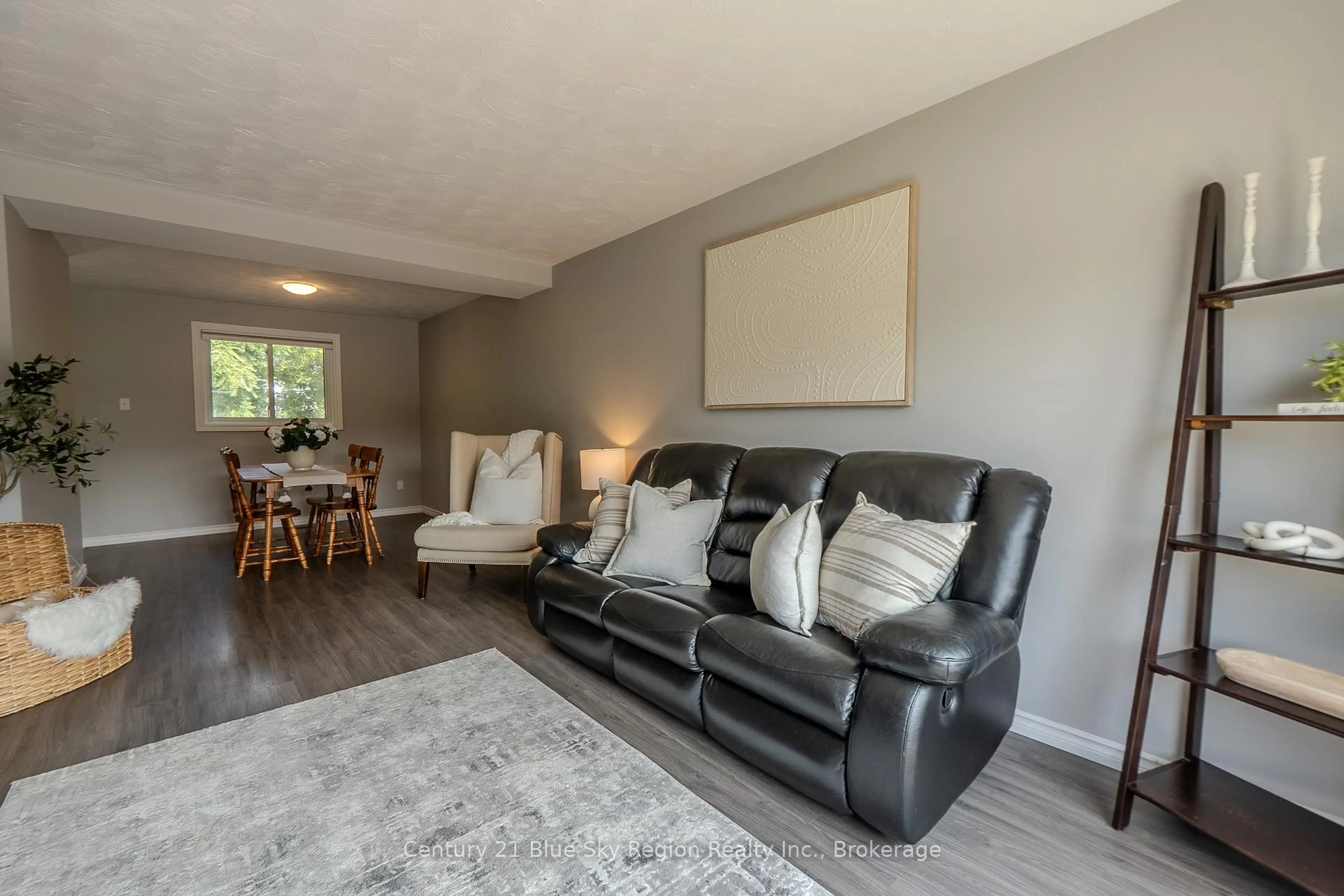 Living room with furniture, wood/laminate floor for 580 Dane Ave, North Bay Ontario P1B 7G6