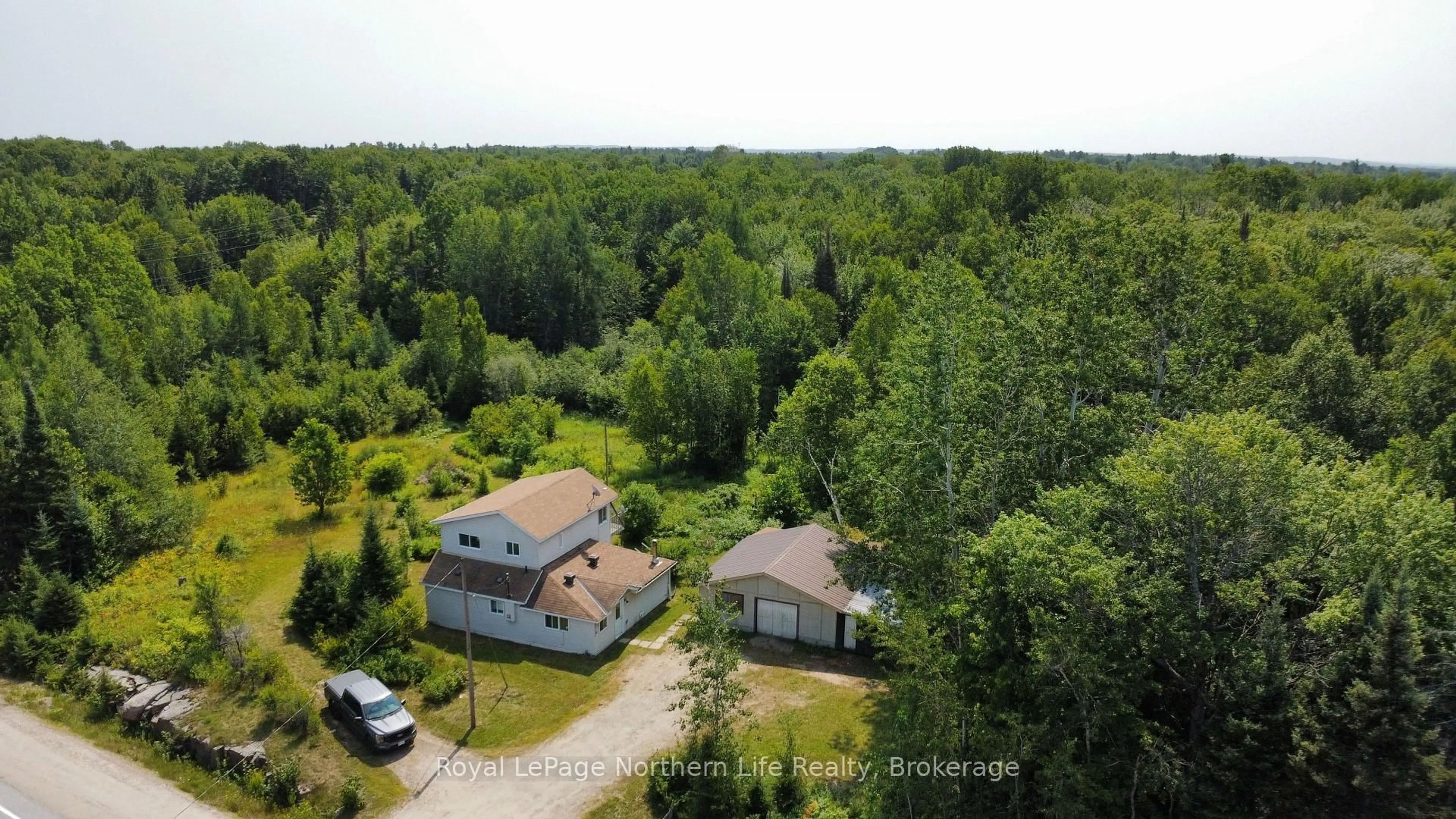 A pic from outside/outdoor area/front of a property/back of a property/a pic from drone, forest/trees view for 202 Highway 17, Bonfield Ontario P1B 8G4