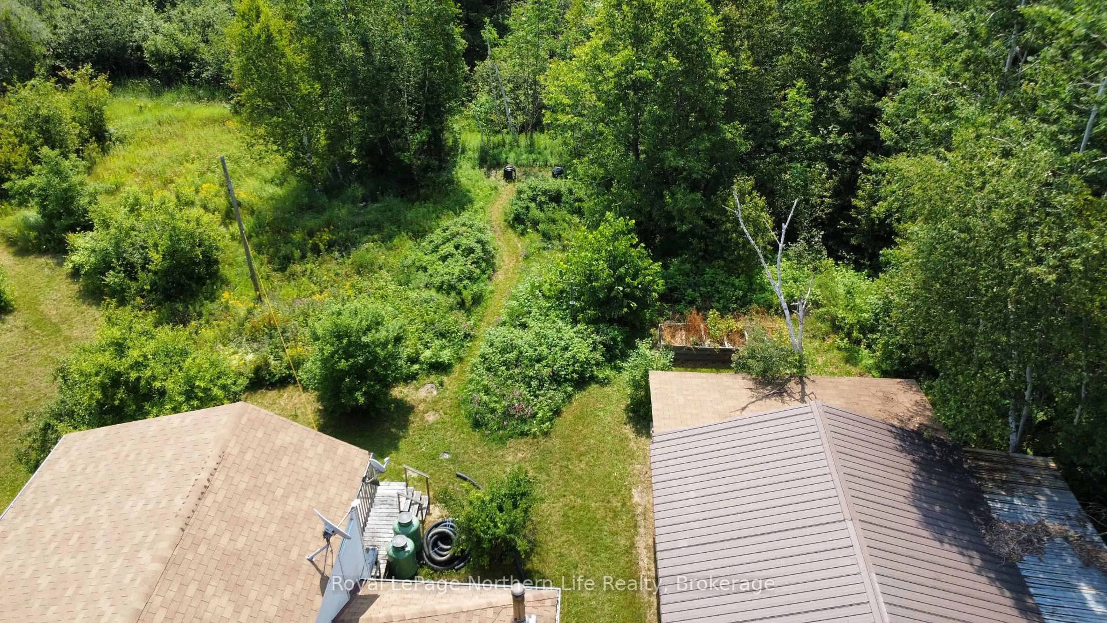 A pic from outside/outdoor area/front of a property/back of a property/a pic from drone, forest/trees view for 202 Highway 17, Bonfield Ontario P1B 8G4
