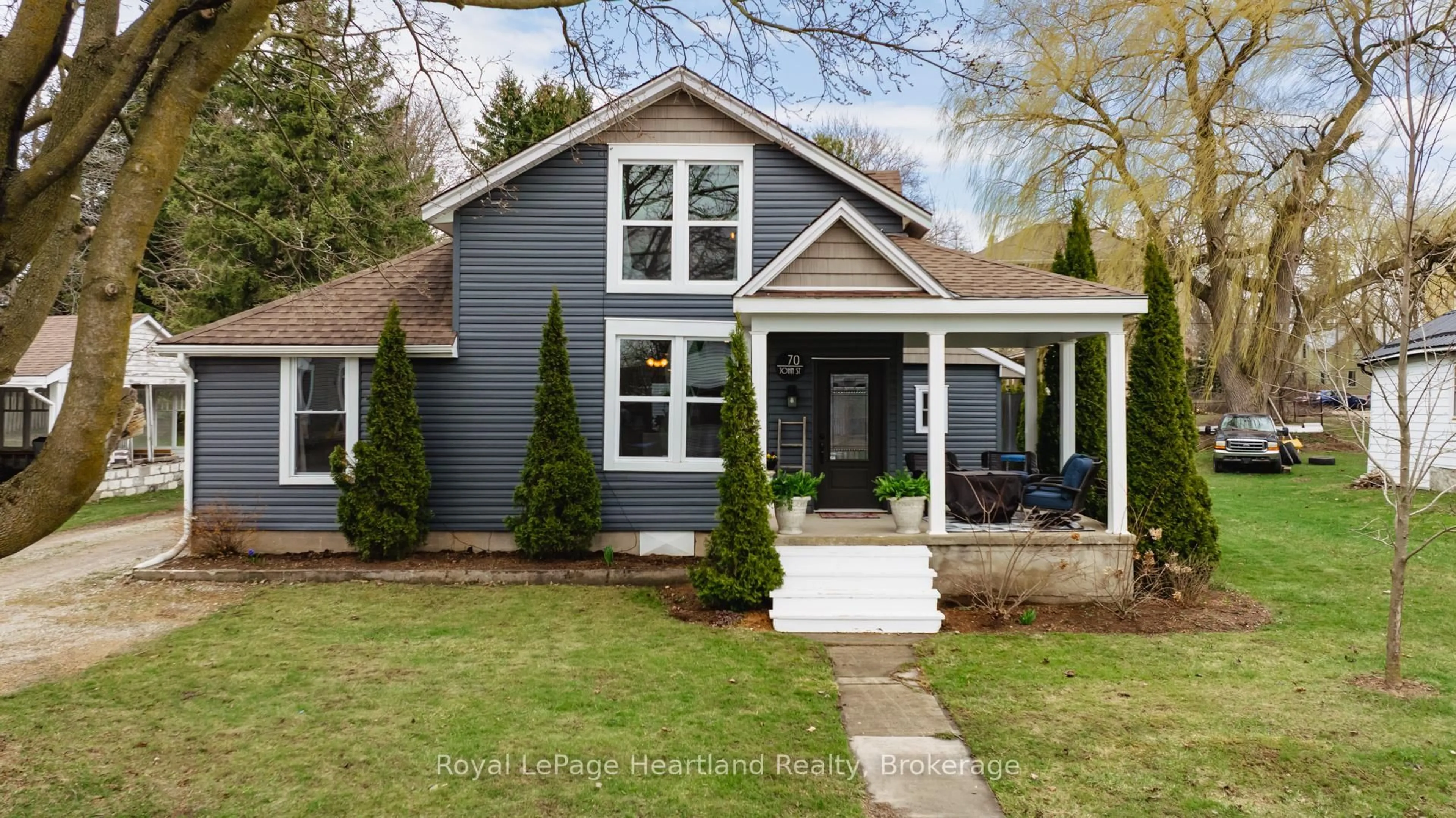 Home with vinyl exterior material, street for 70 John St, Huron East Ontario N0K 1W0