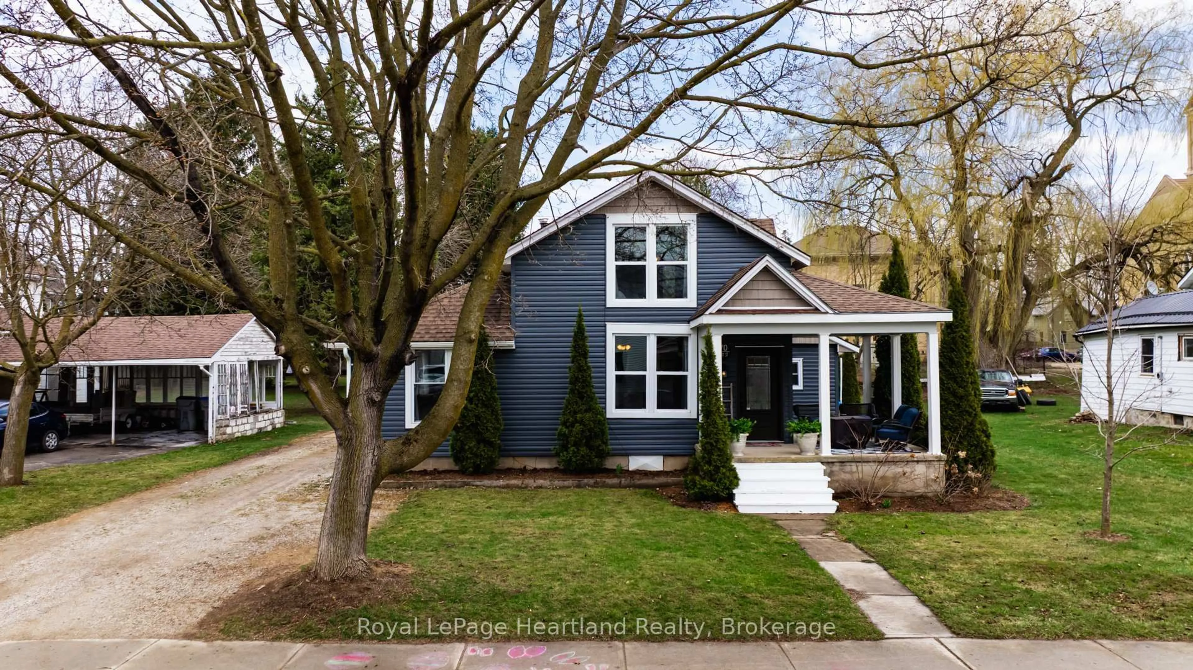 Home with vinyl exterior material, street for 70 John St, Huron East Ontario N0K 1W0