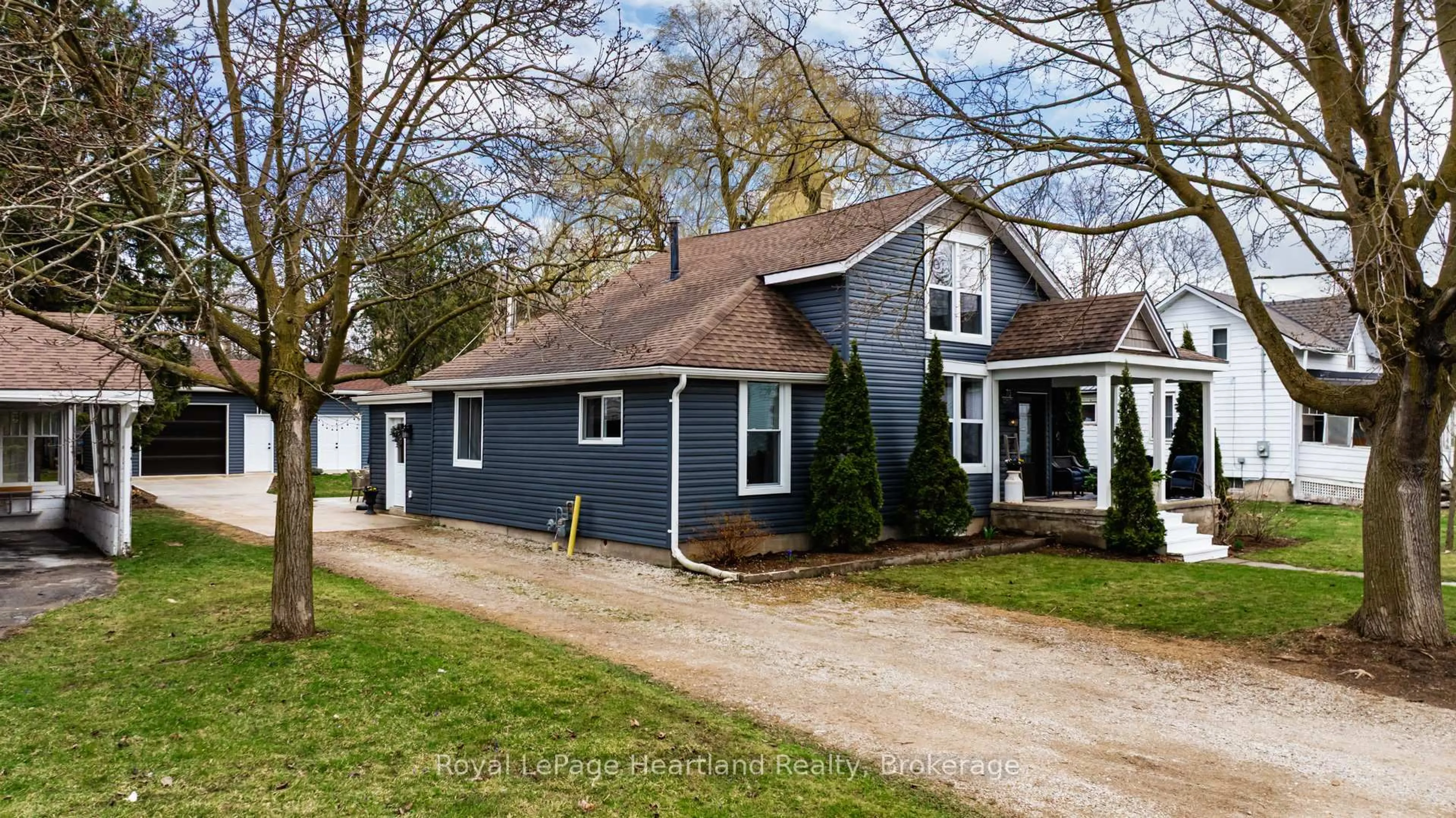 Home with vinyl exterior material, street for 70 John St, Huron East Ontario N0K 1W0