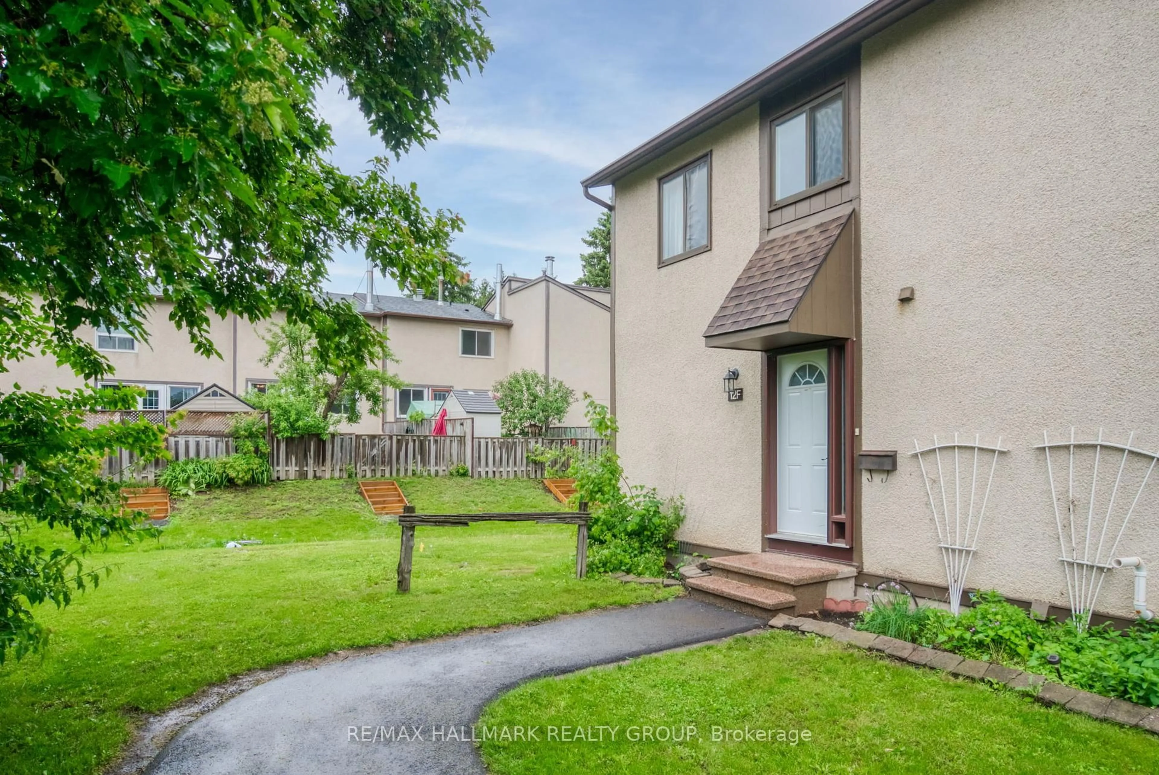 A pic from outside/outdoor area/front of a property/back of a property/a pic from drone, street for 12F Larkshire Lane, Ottawa Ontario K2J 1Y6