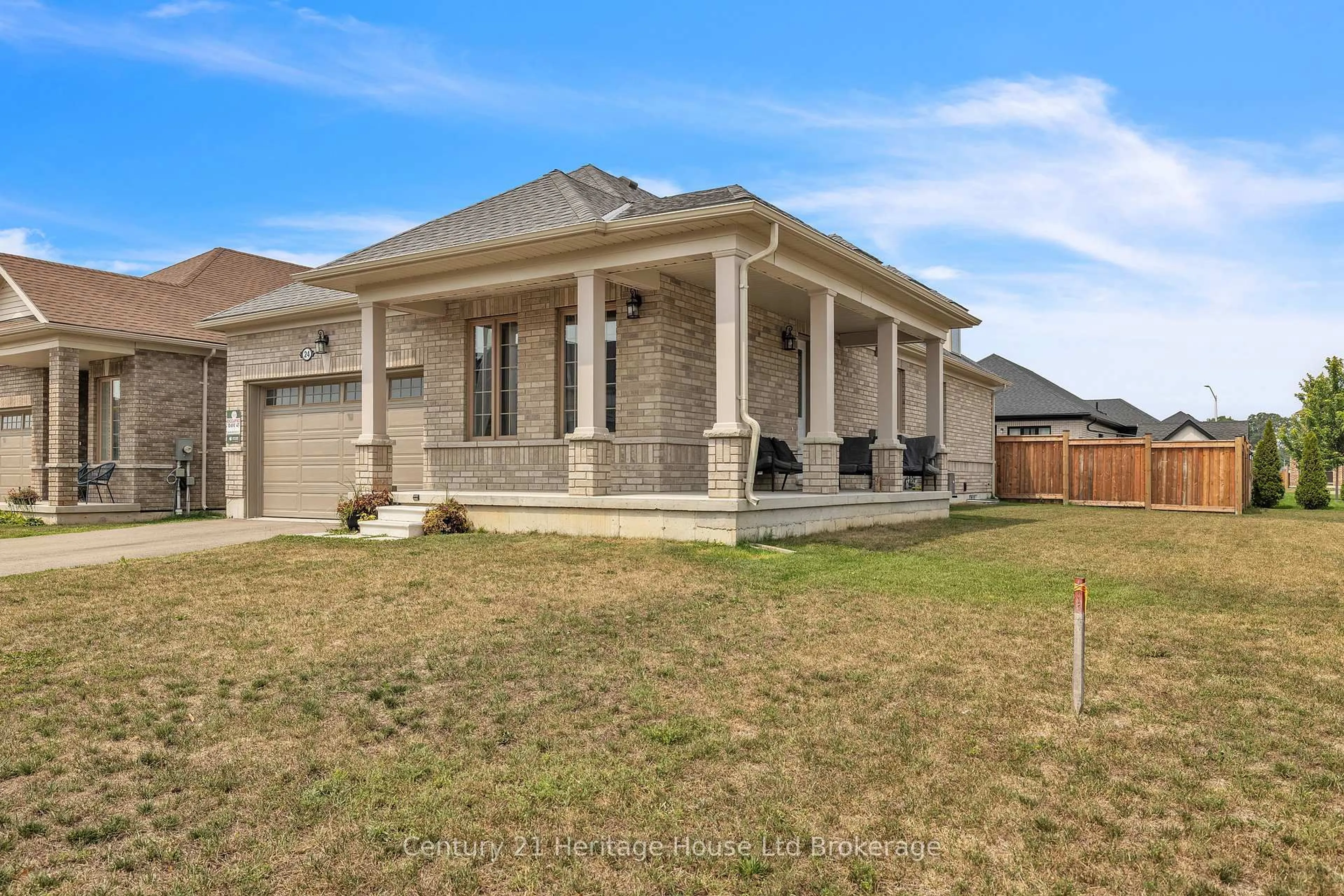 Home with brick exterior material, street for 24 HARWOOD St, Tillsonburg Ontario N4G 0J8
