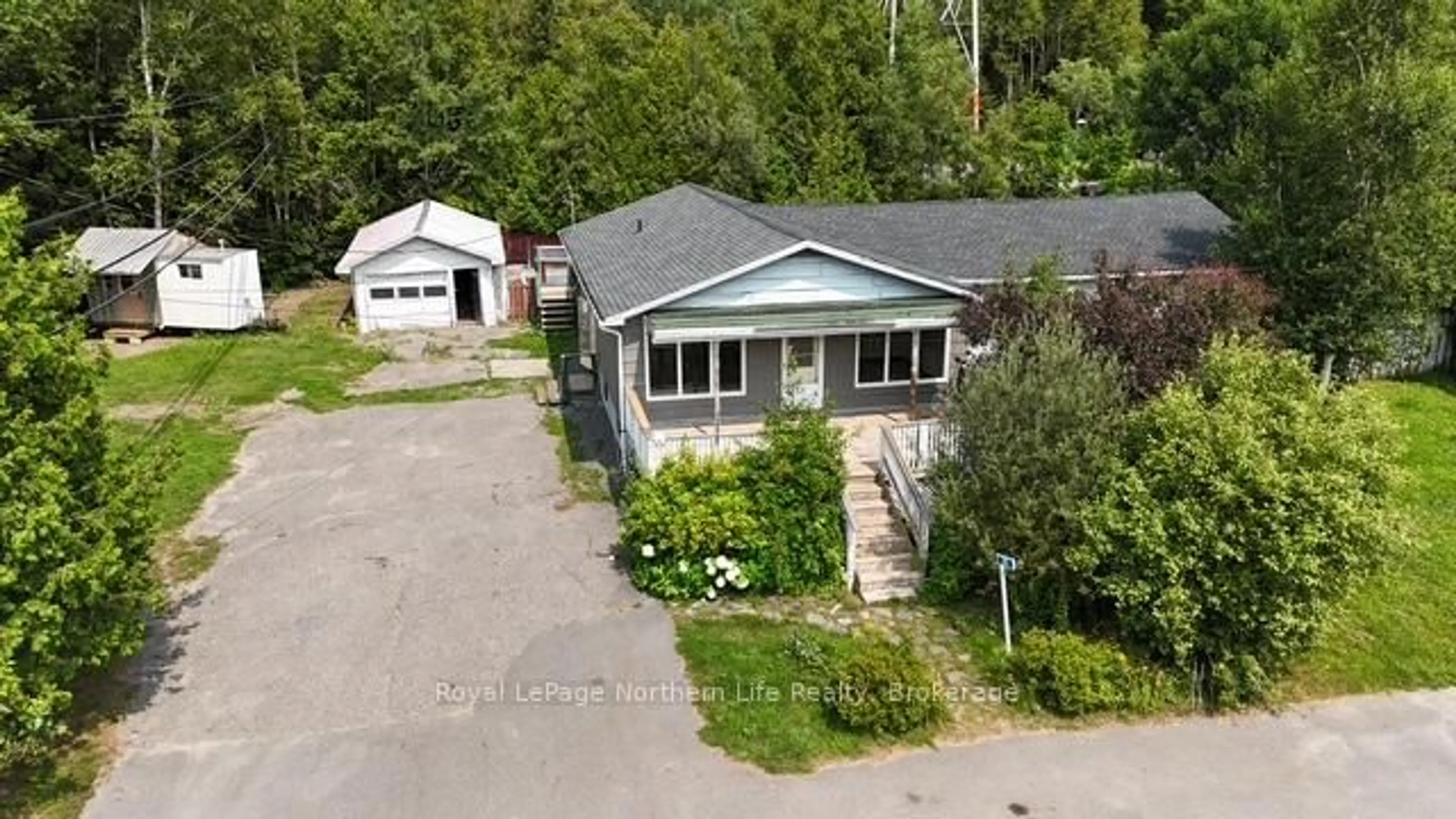 A pic from outside/outdoor area/front of a property/back of a property/a pic from drone, street for 24-26 Spruce Dr, Temagami Ontario P0H 2H0