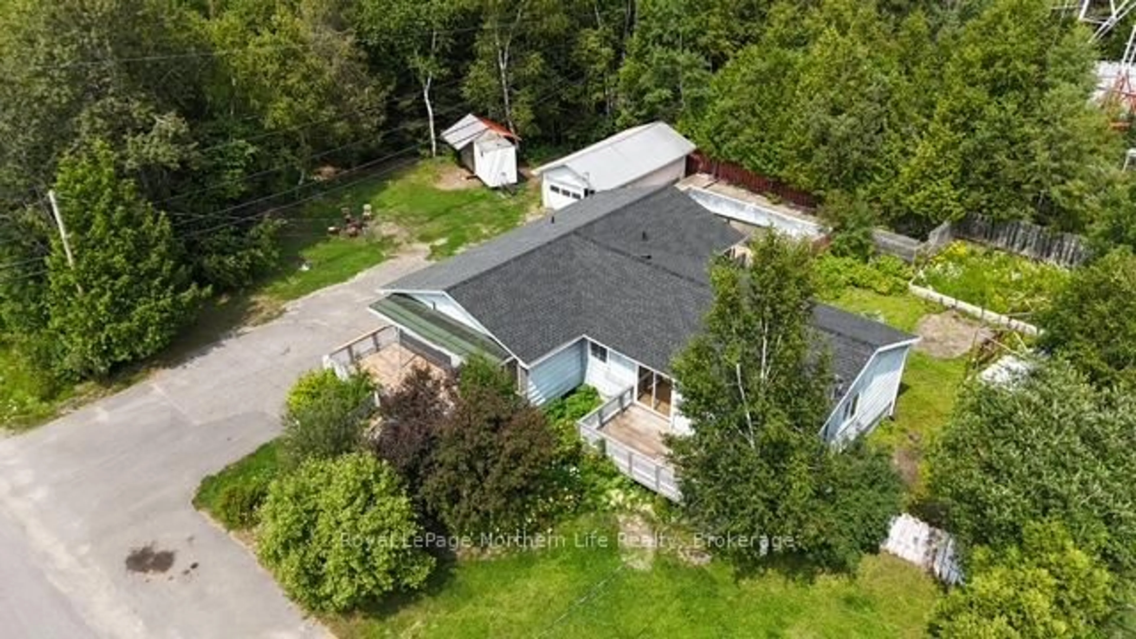A pic from outside/outdoor area/front of a property/back of a property/a pic from drone, unknown for 24-26 Spruce Dr, Temagami Ontario P0H 2H0
