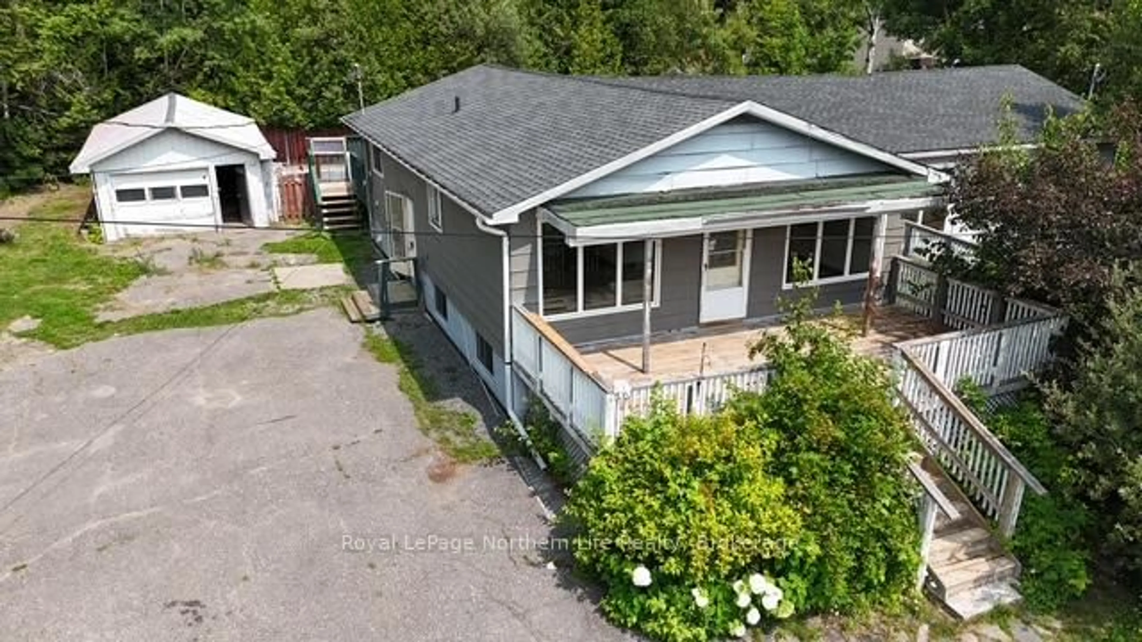 A pic from outside/outdoor area/front of a property/back of a property/a pic from drone, street for 24-26 Spruce Dr, Temagami Ontario P0H 2H0