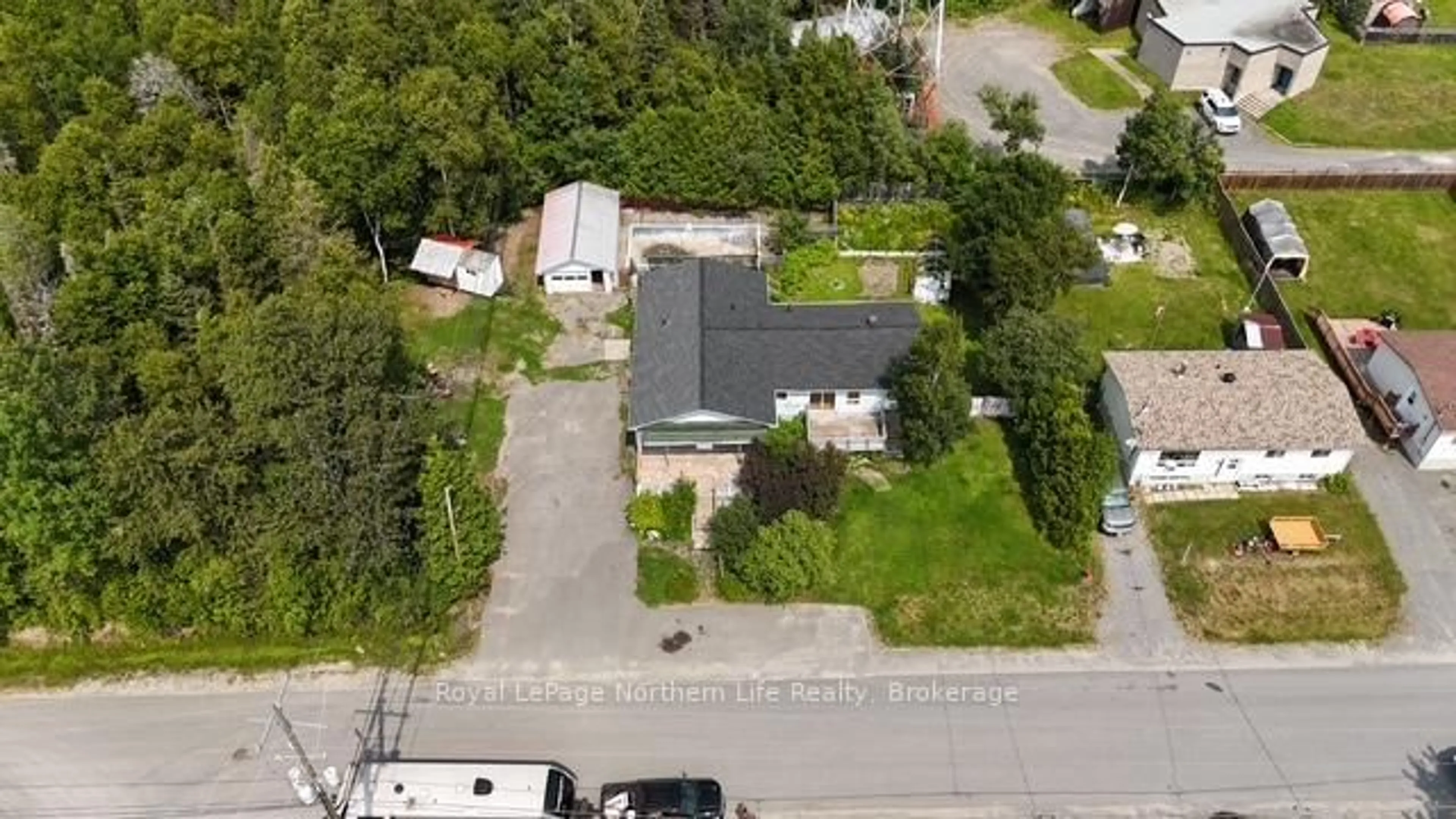 A pic from outside/outdoor area/front of a property/back of a property/a pic from drone, street for 24-26 Spruce Dr, Temagami Ontario P0H 2H0