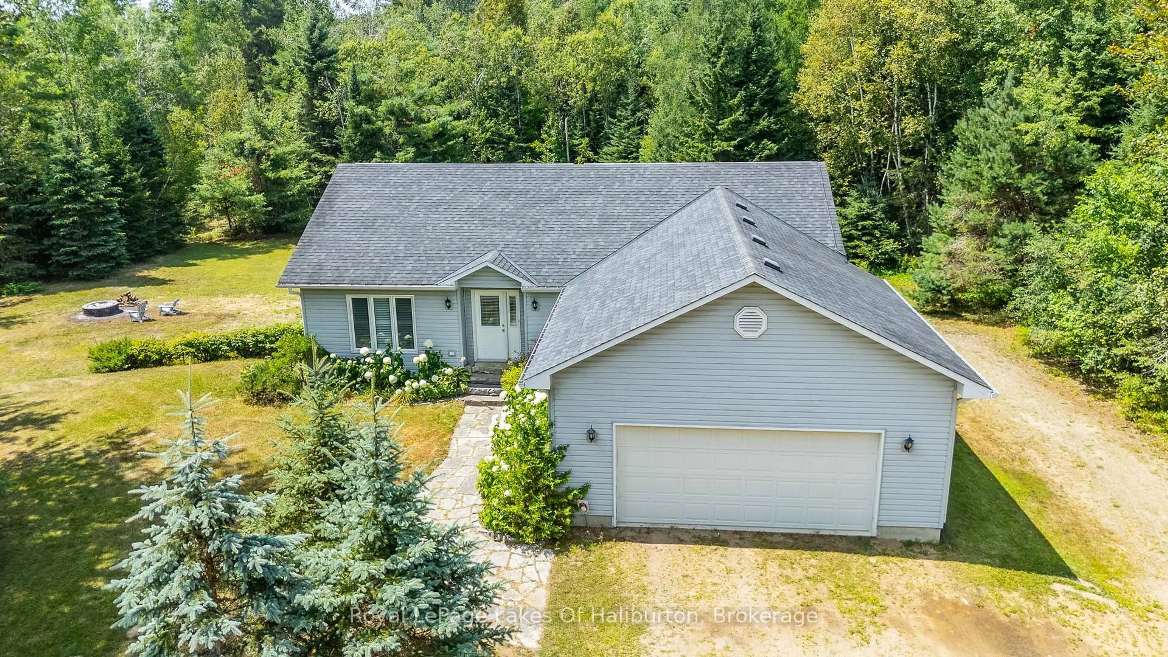 A pic from outside/outdoor area/front of a property/back of a property/a pic from drone, street for 1030 Sawdust Rd, Minden Hills Ontario K0M 2K0