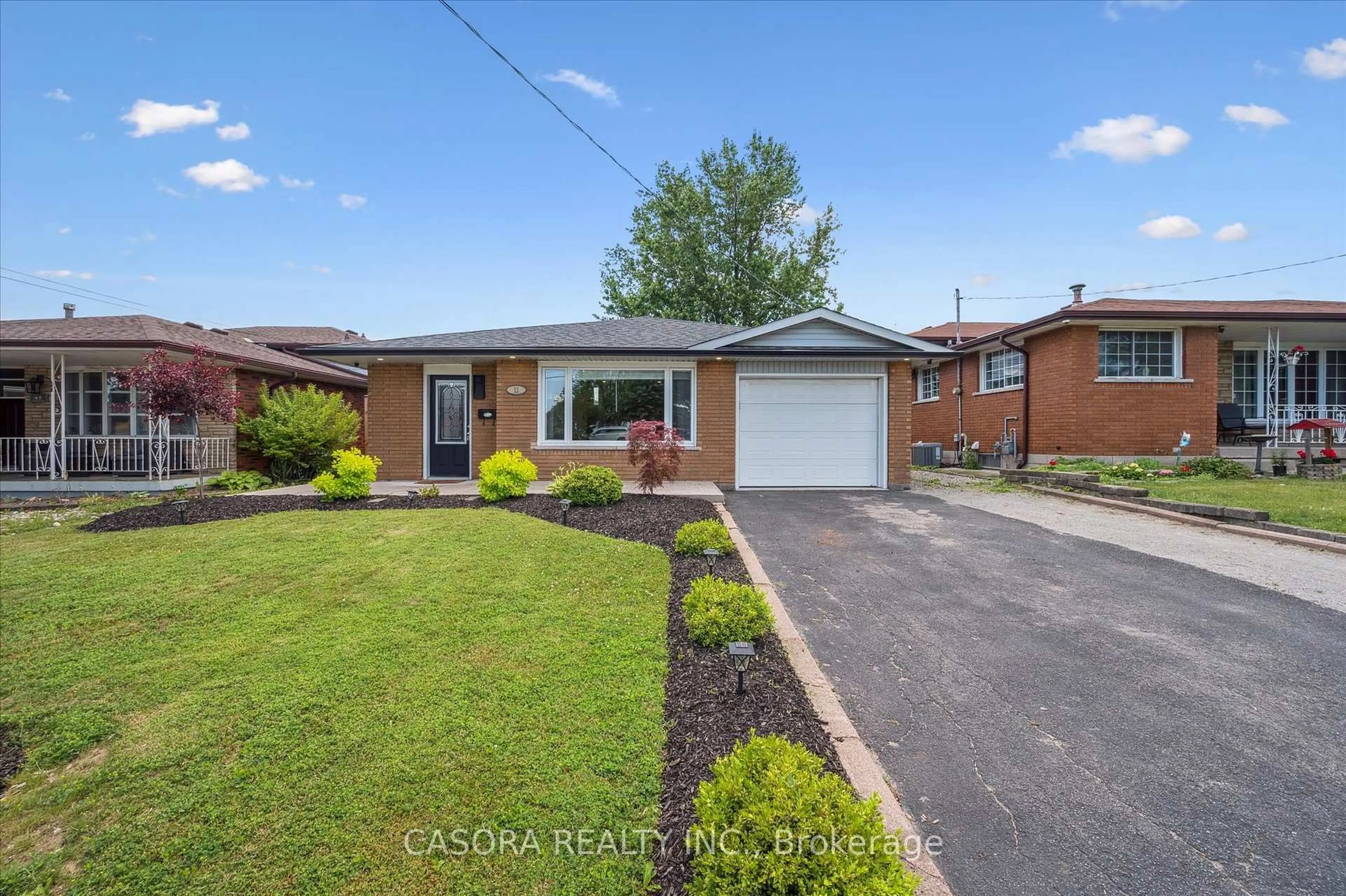 Home with brick exterior material, street for 12 Anson Ave, Hamilton Ontario L8T 2X3