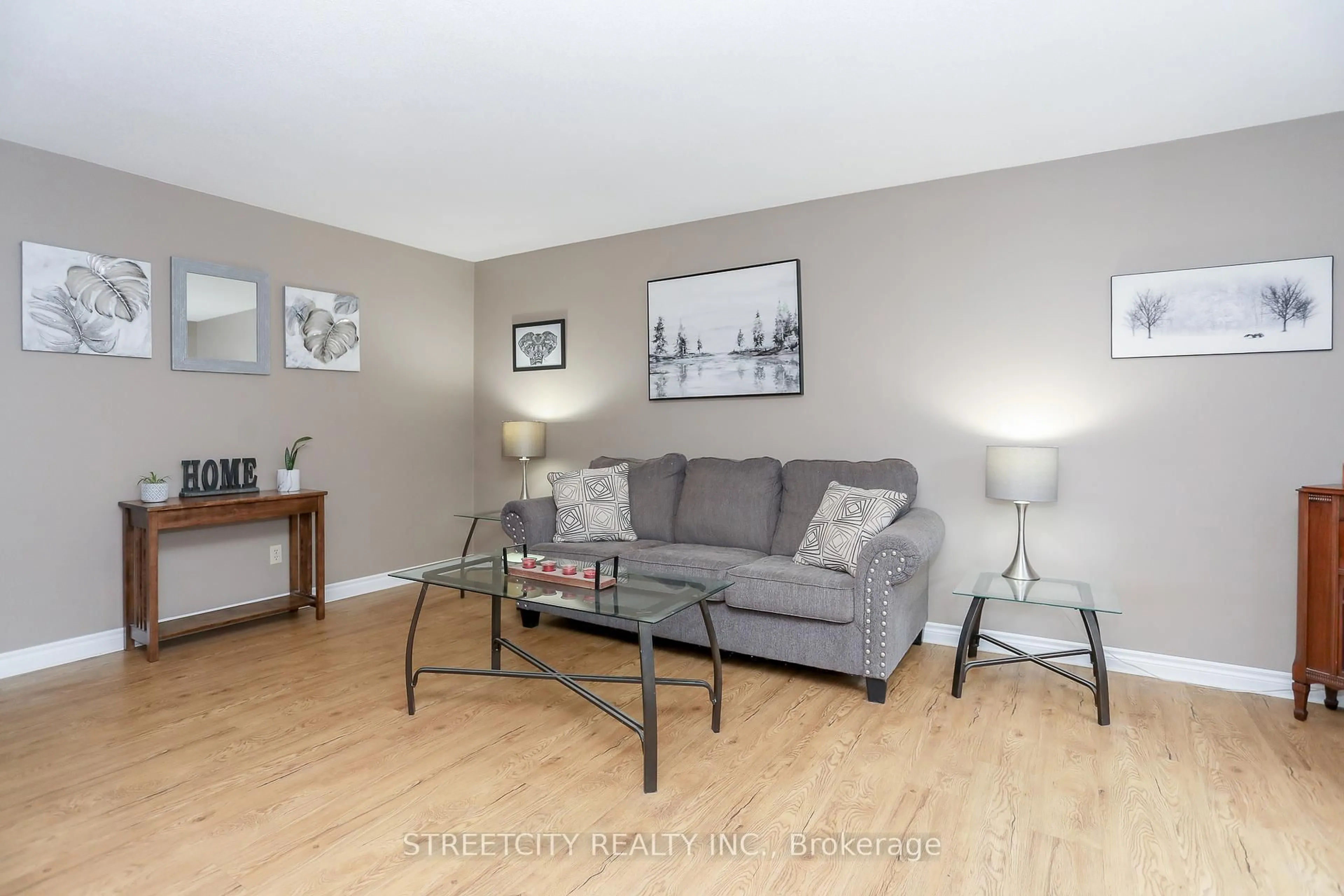 Living room with furniture, wood/laminate floor for 9 Cottonwood Cres, London North Ontario N6G 2Y7