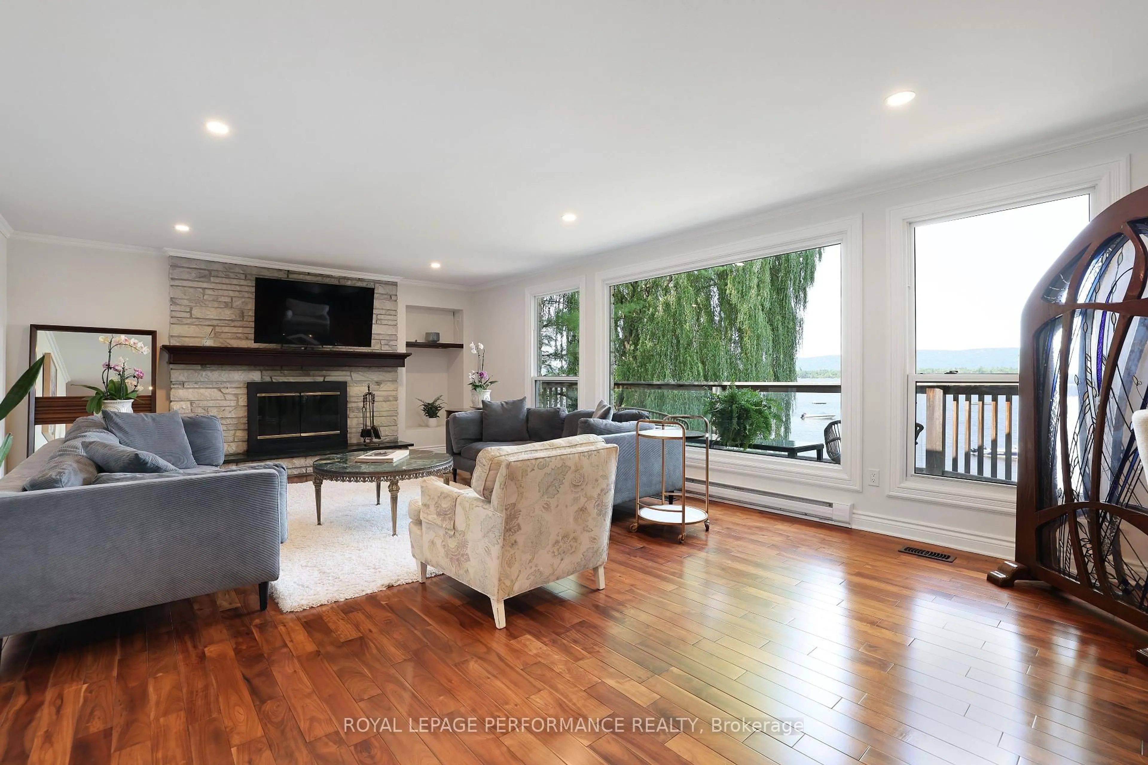 Living room with furniture, wood/laminate floor for 4004 Armitage Ave, Ottawa Ontario K0A 1T0