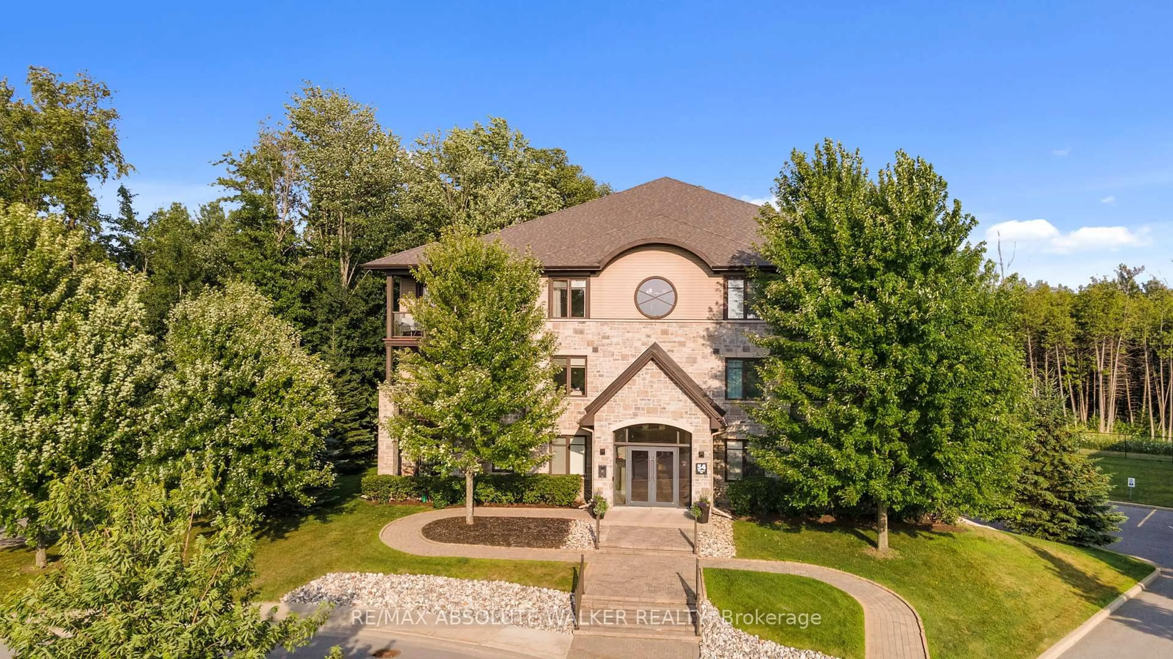 A pic from outside/outdoor area/front of a property/back of a property/a pic from drone, building for 54 Magnolia Way #301, North Grenville Ontario K0G 1J0