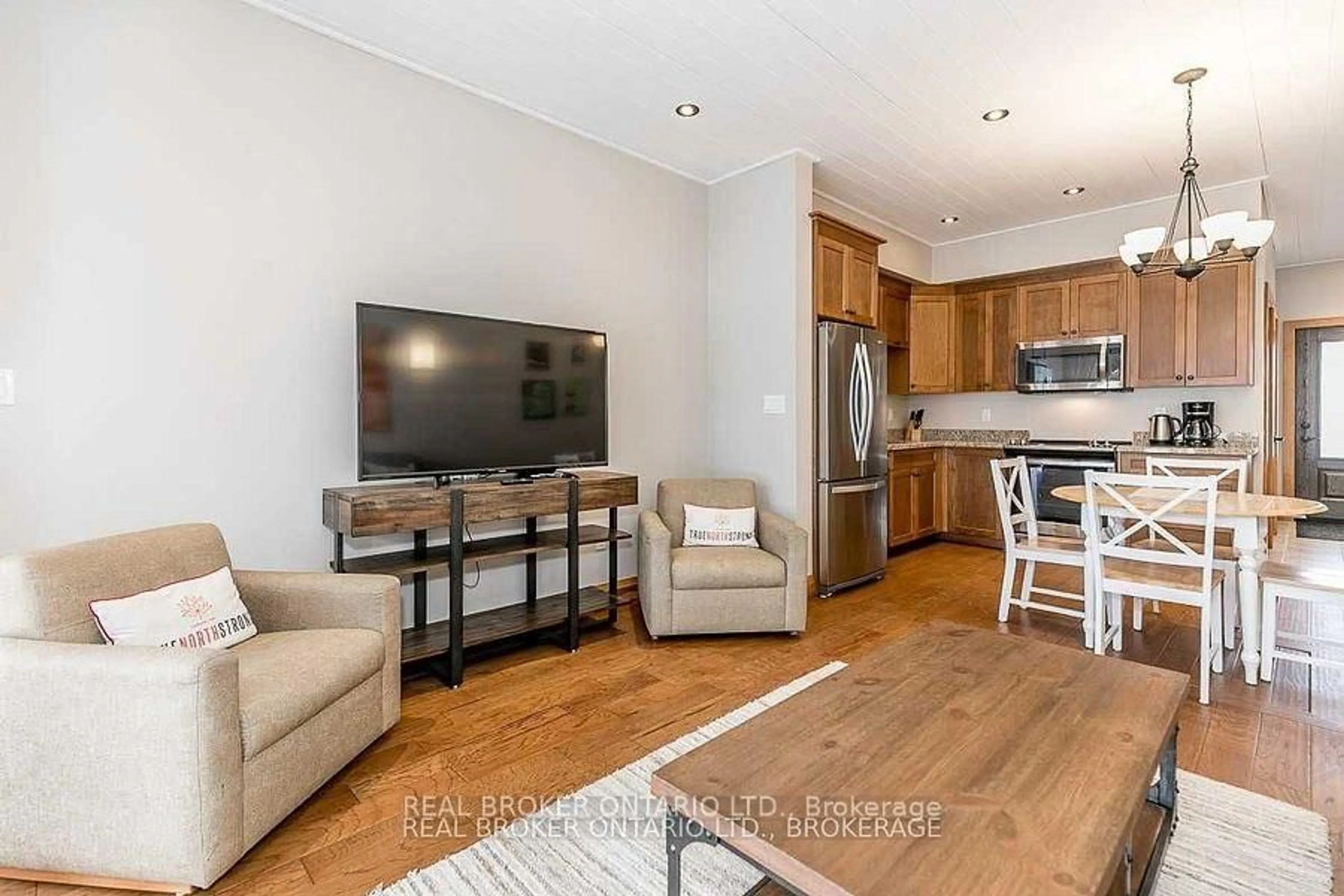 Living room with furniture, wood/laminate floor for 1841 Muskoka Road 118 Rd #2B, Muskoka Lakes Ontario P1L 1W8