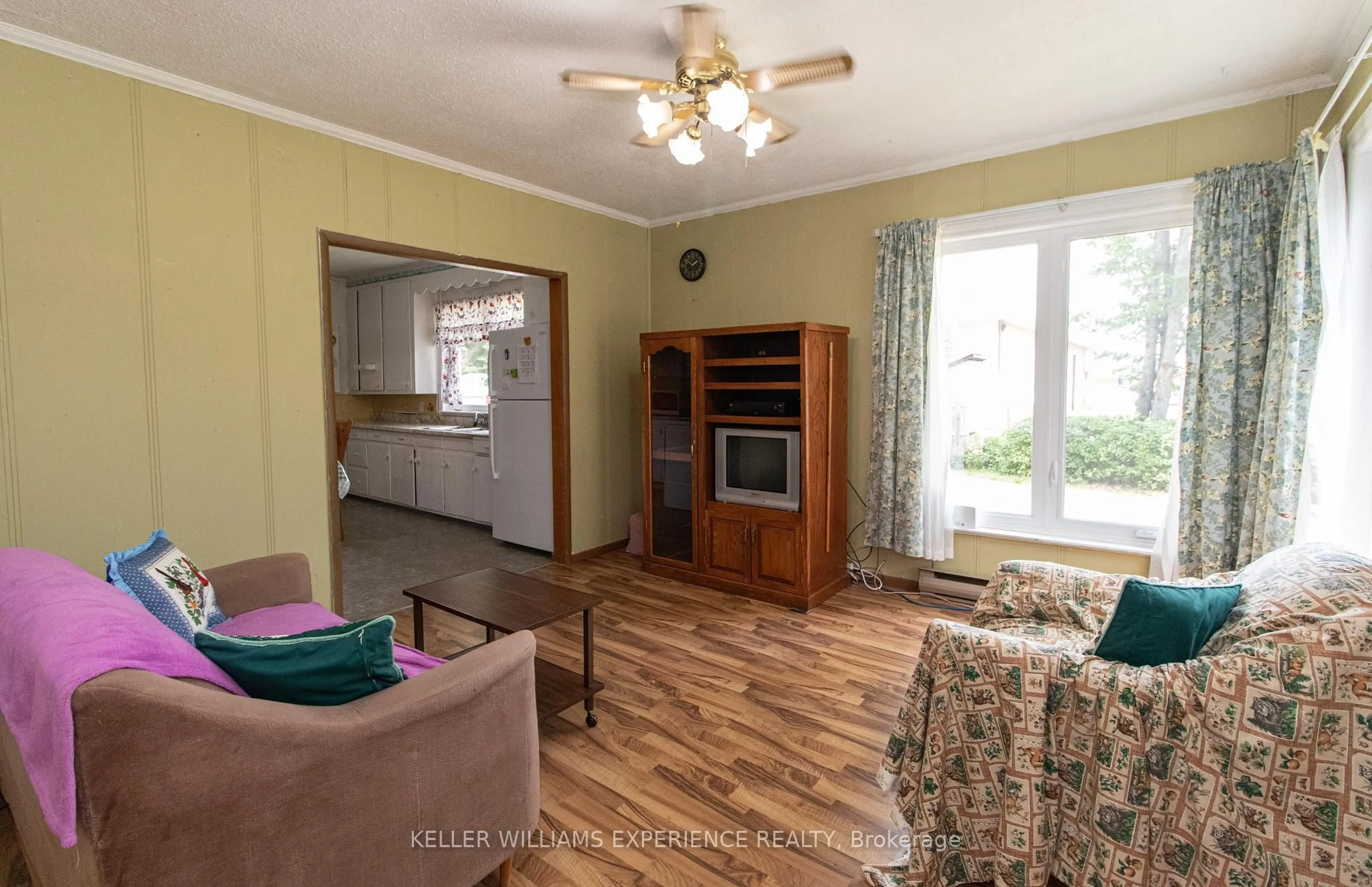 Living room with furniture, wood/laminate floor for 152 Ottawa Ave, South River Ontario P0A 1X0