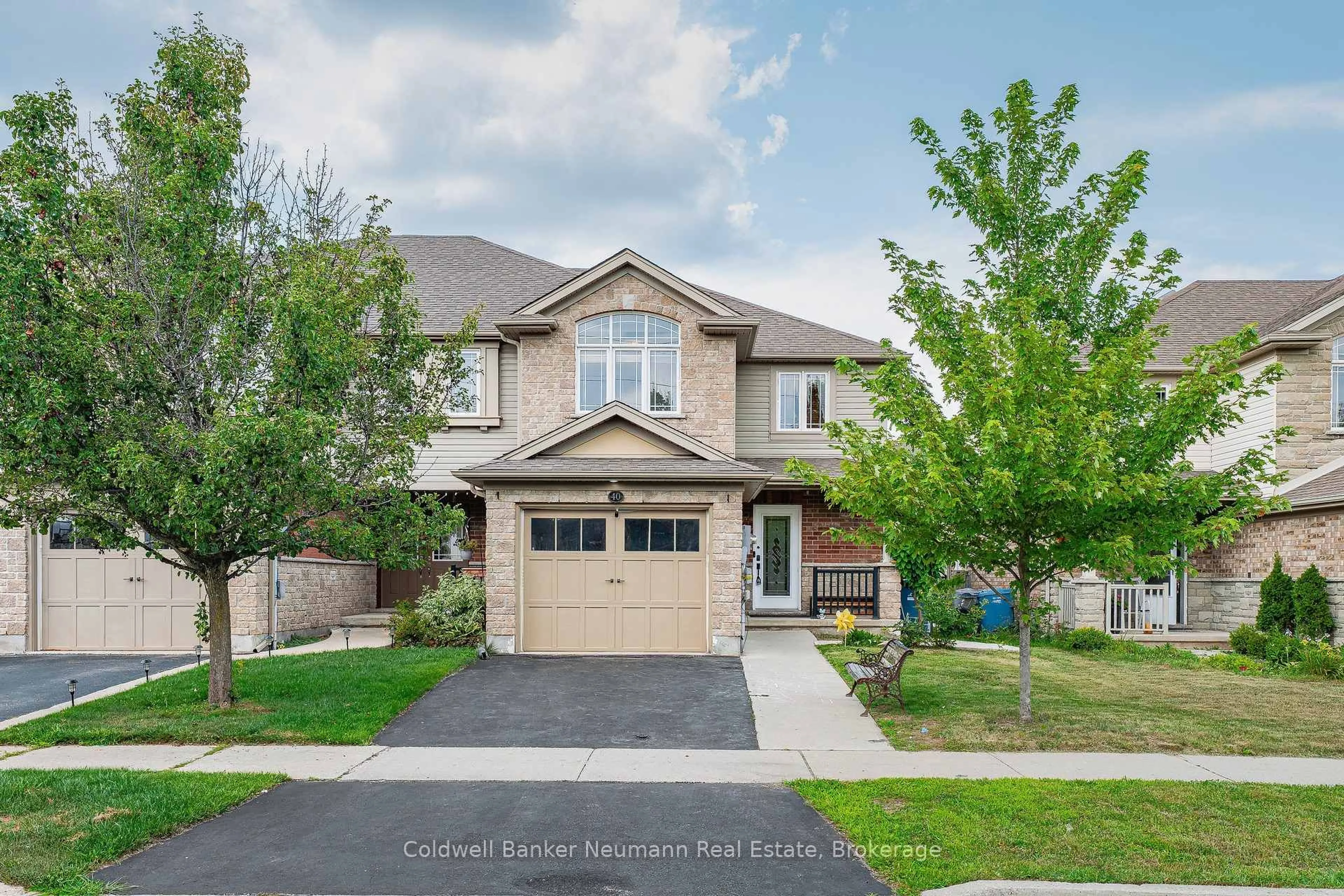Home with brick exterior material, street for 40 Laughland Lane, Guelph Ontario N1L 0C9