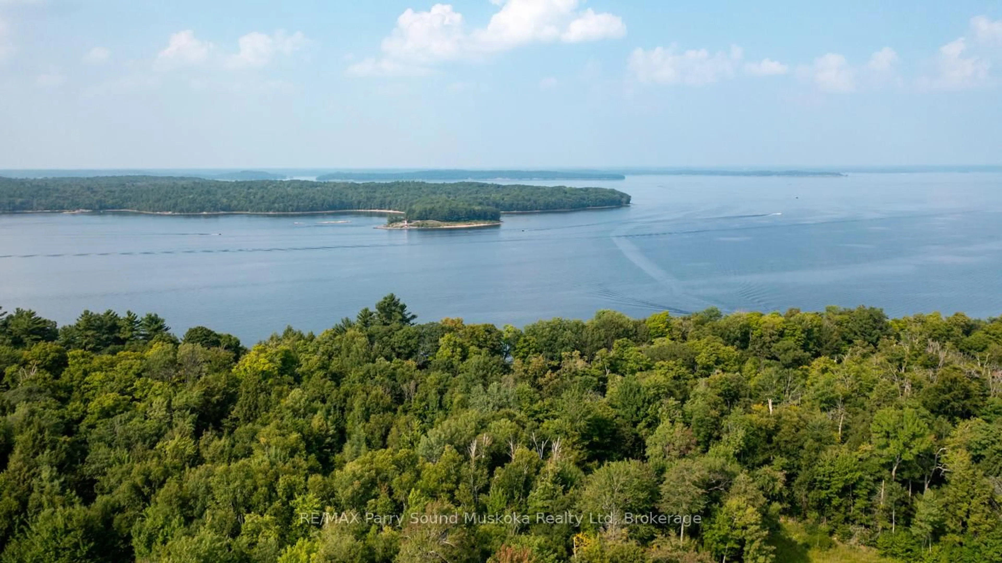 A pic from outside/outdoor area/front of a property/back of a property/a pic from drone, water/lake/river/ocean view for 808 Paradise Lane #Lot 206, Carling Ontario P2A 2X4