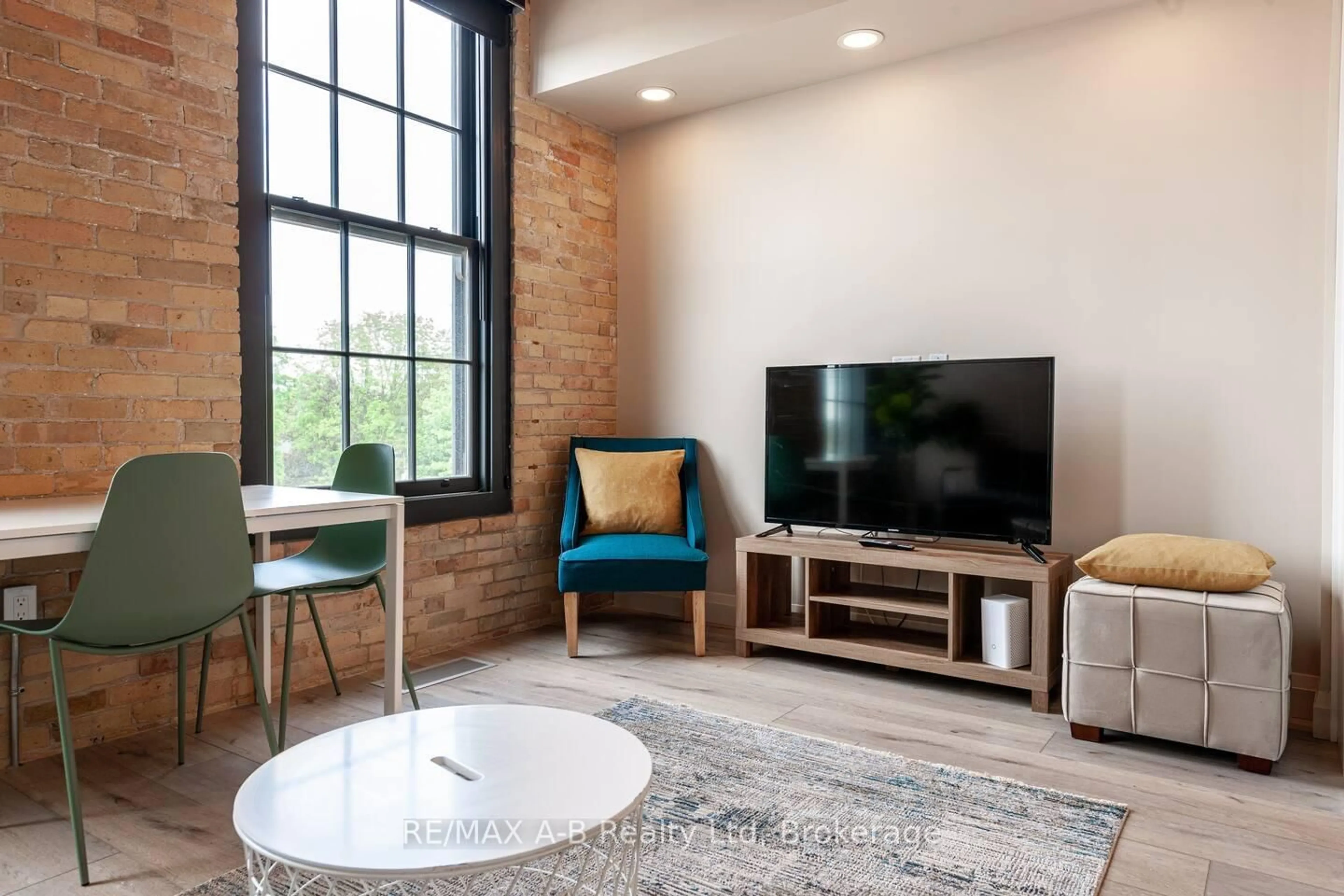 Living room with furniture, unknown for 245 Downie St #208, Stratford Ontario N5A 1X5