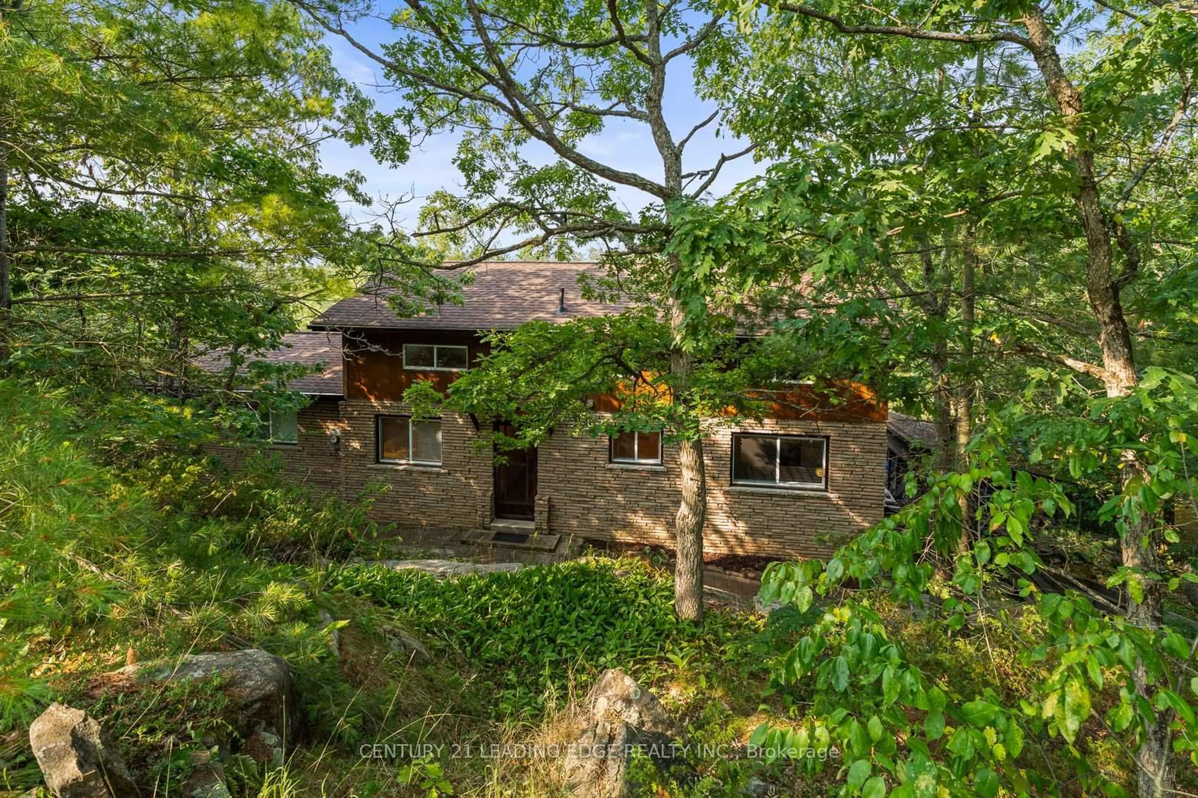 A pic from outside/outdoor area/front of a property/back of a property/a pic from drone, forest/trees view for 764 Peninsula Rd, Gravenhurst Ontario P0E 1G0