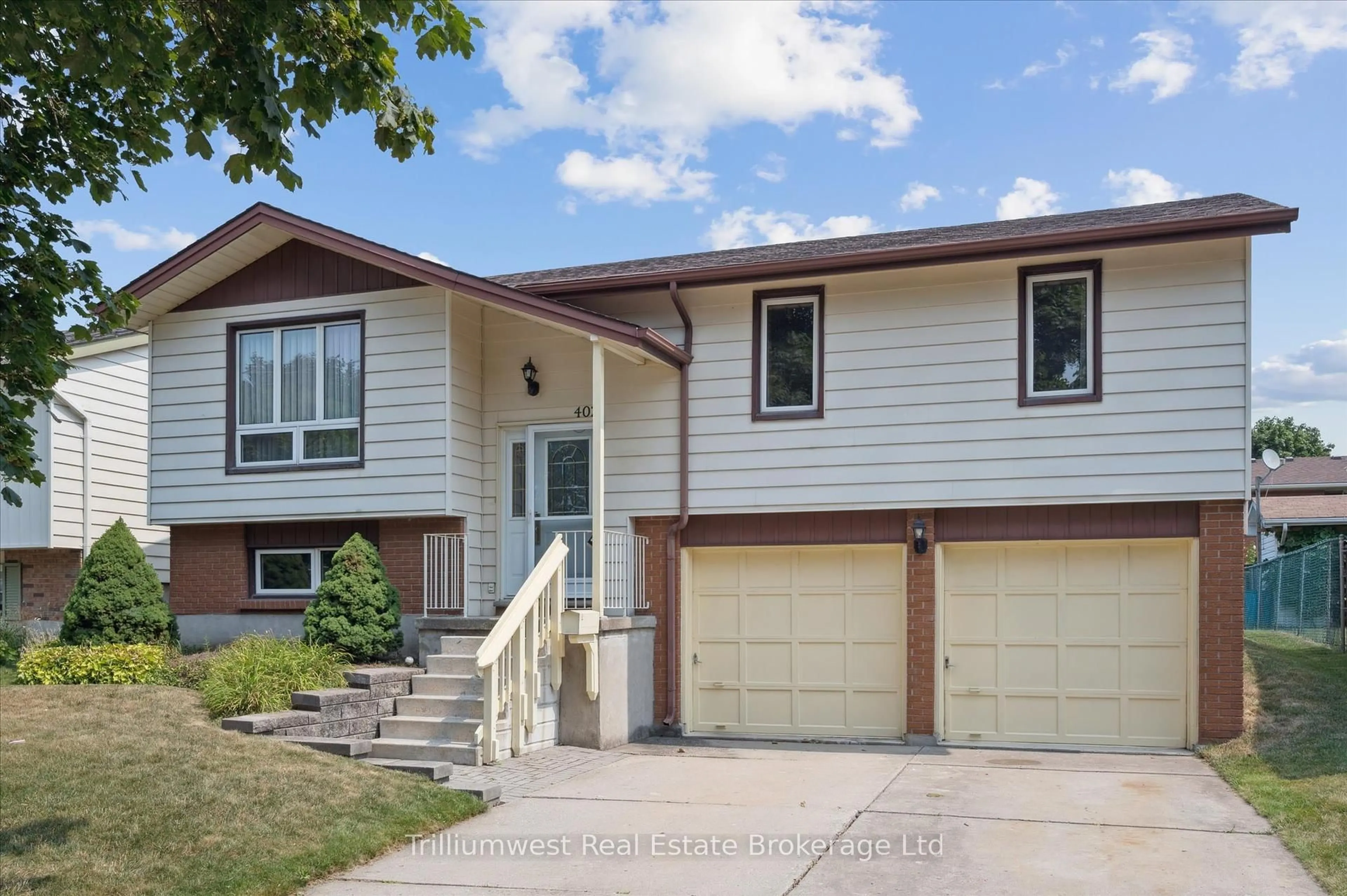 Home with vinyl exterior material, street for 402 Heritage Dr, Kitchener Ontario N2B 3M9