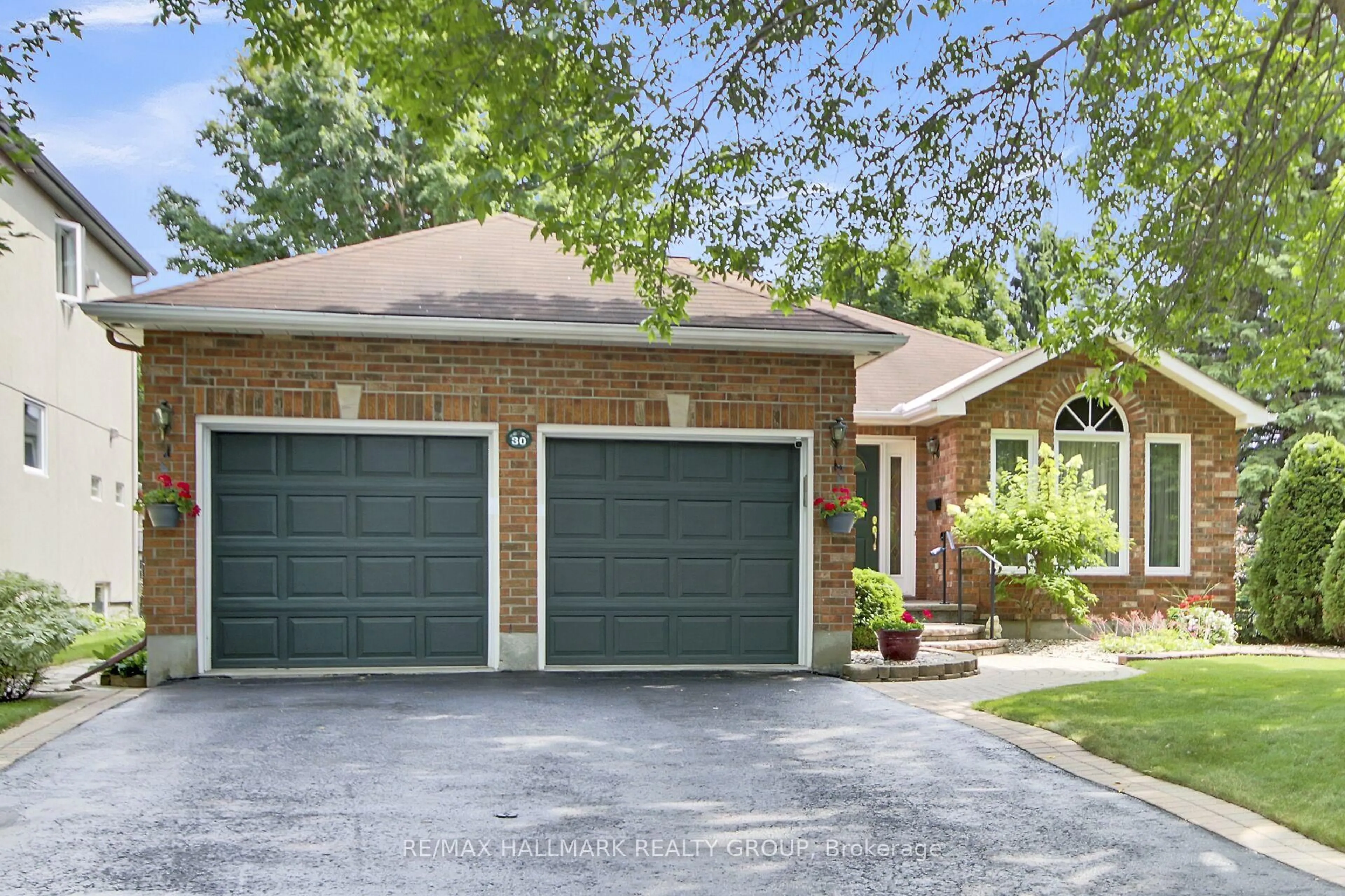 Home with brick exterior material, street for 30 Langford Cres, Ottawa Ontario K2K 2N5