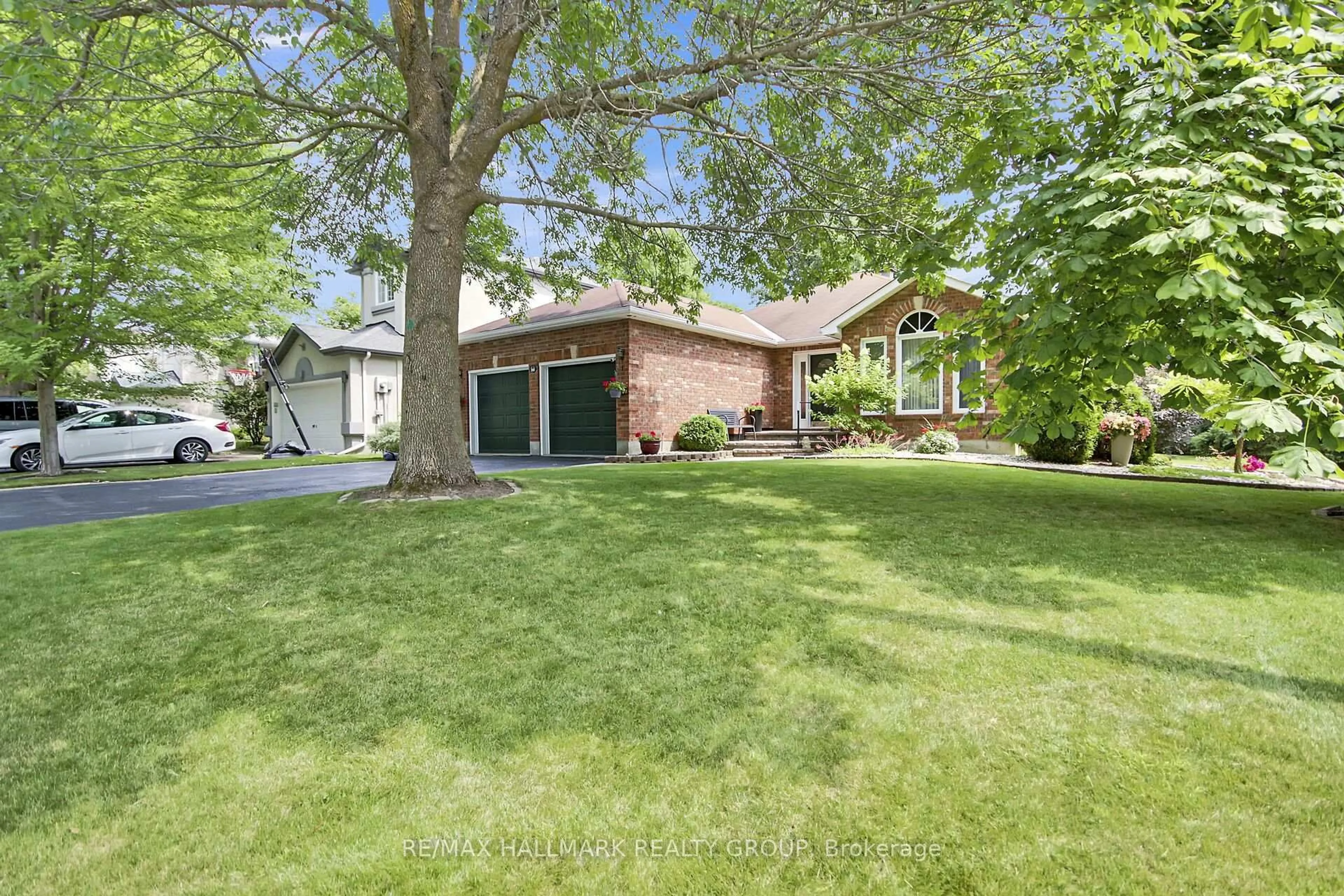 Home with brick exterior material, street for 30 Langford Cres, Ottawa Ontario K2K 2N5