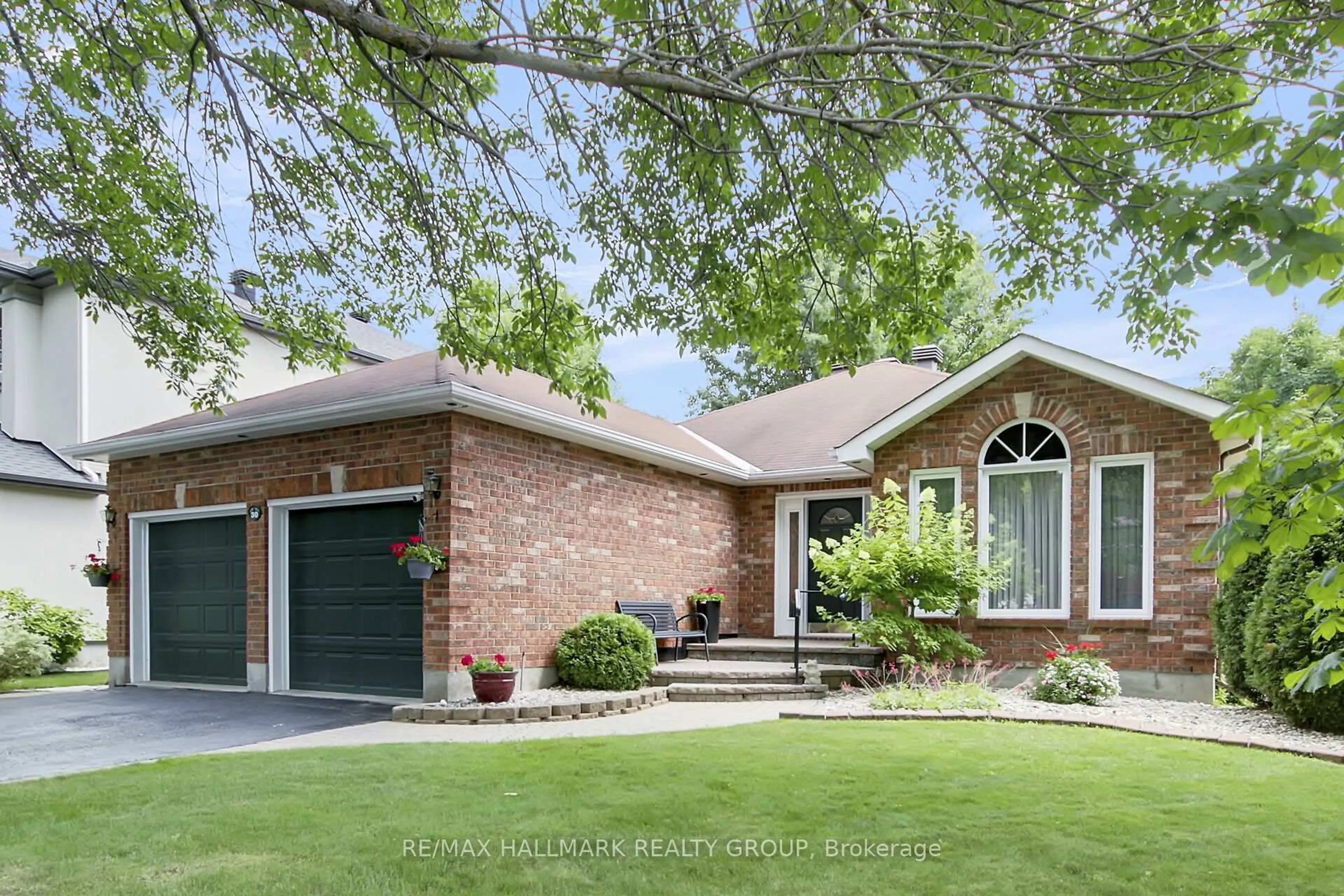 Home with brick exterior material, street for 30 Langford Cres, Ottawa Ontario K2K 2N5