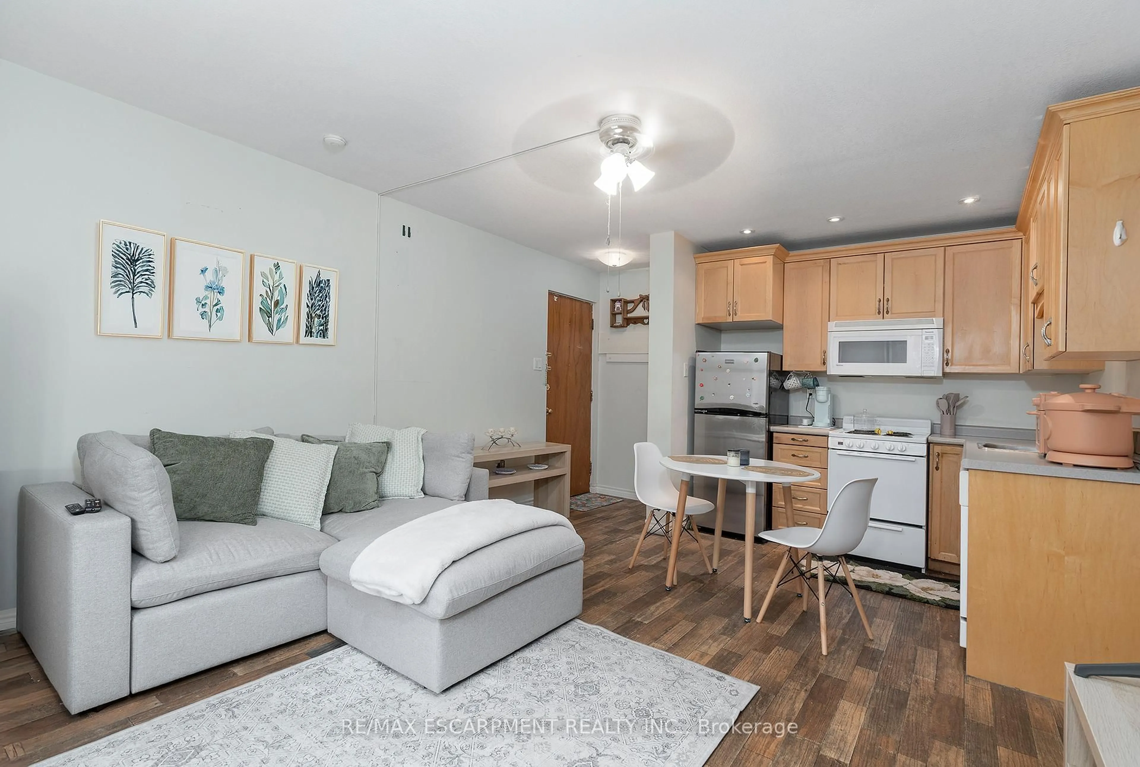 Living room with furniture, wood/laminate floor for 1759 King St #14, Hamilton Ontario L8K 1V6