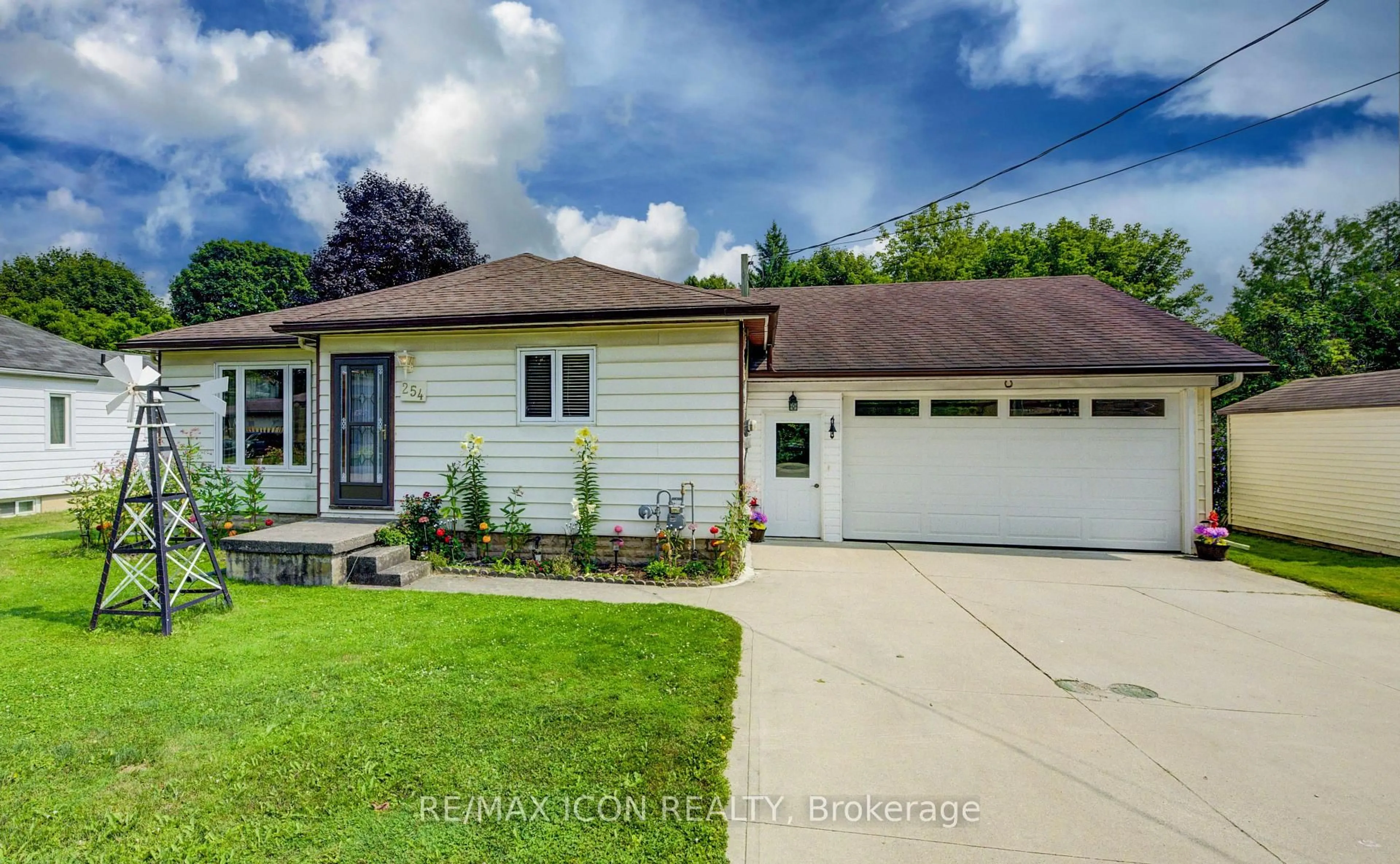 Home with vinyl exterior material, street for 254 Wellington St, Wellington North Ontario N0G 2L0