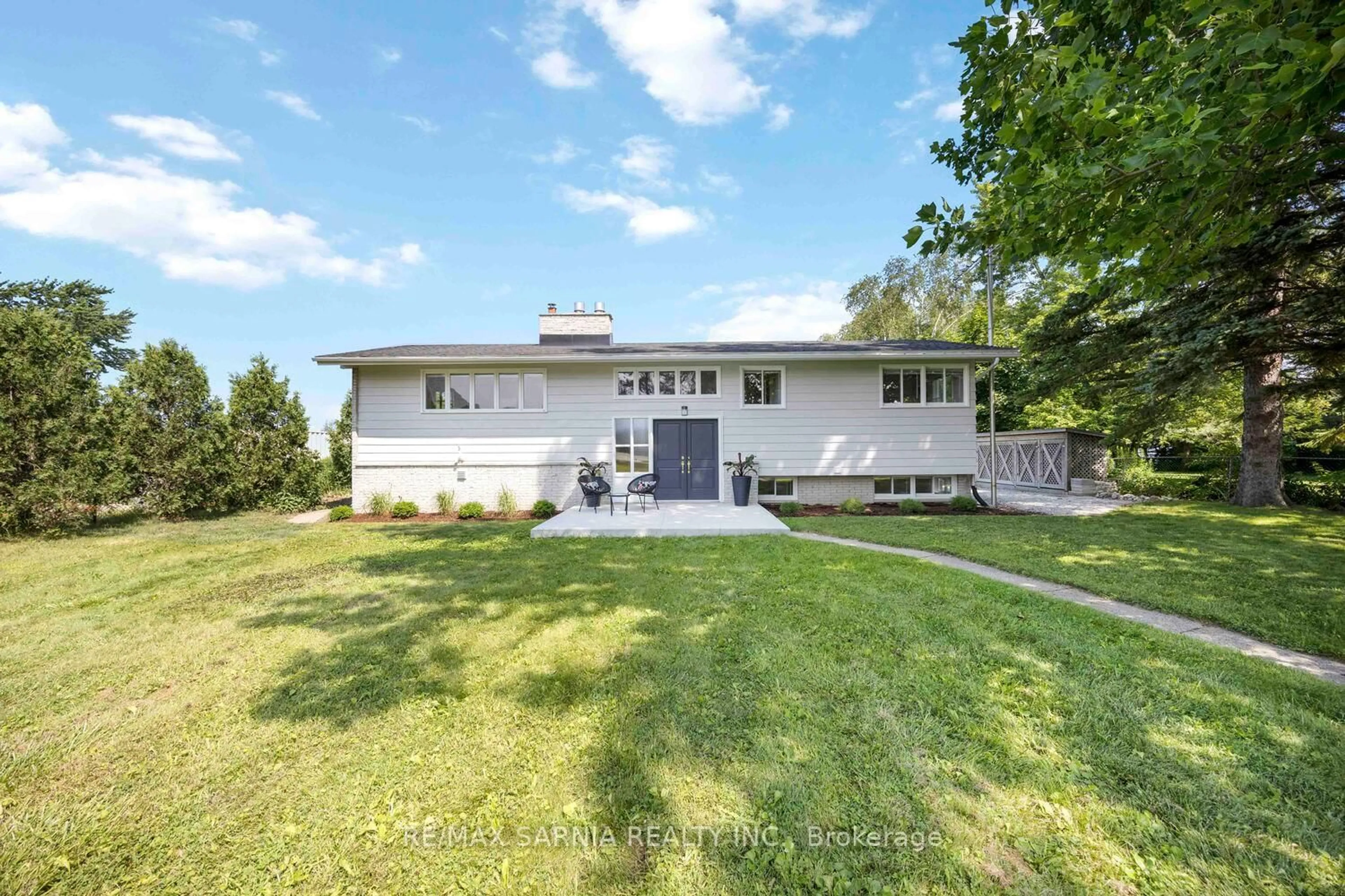 A pic from outside/outdoor area/front of a property/back of a property/a pic from drone, unknown for 3554 Queen St, Plympton-Wyoming Ontario N0N 1E0