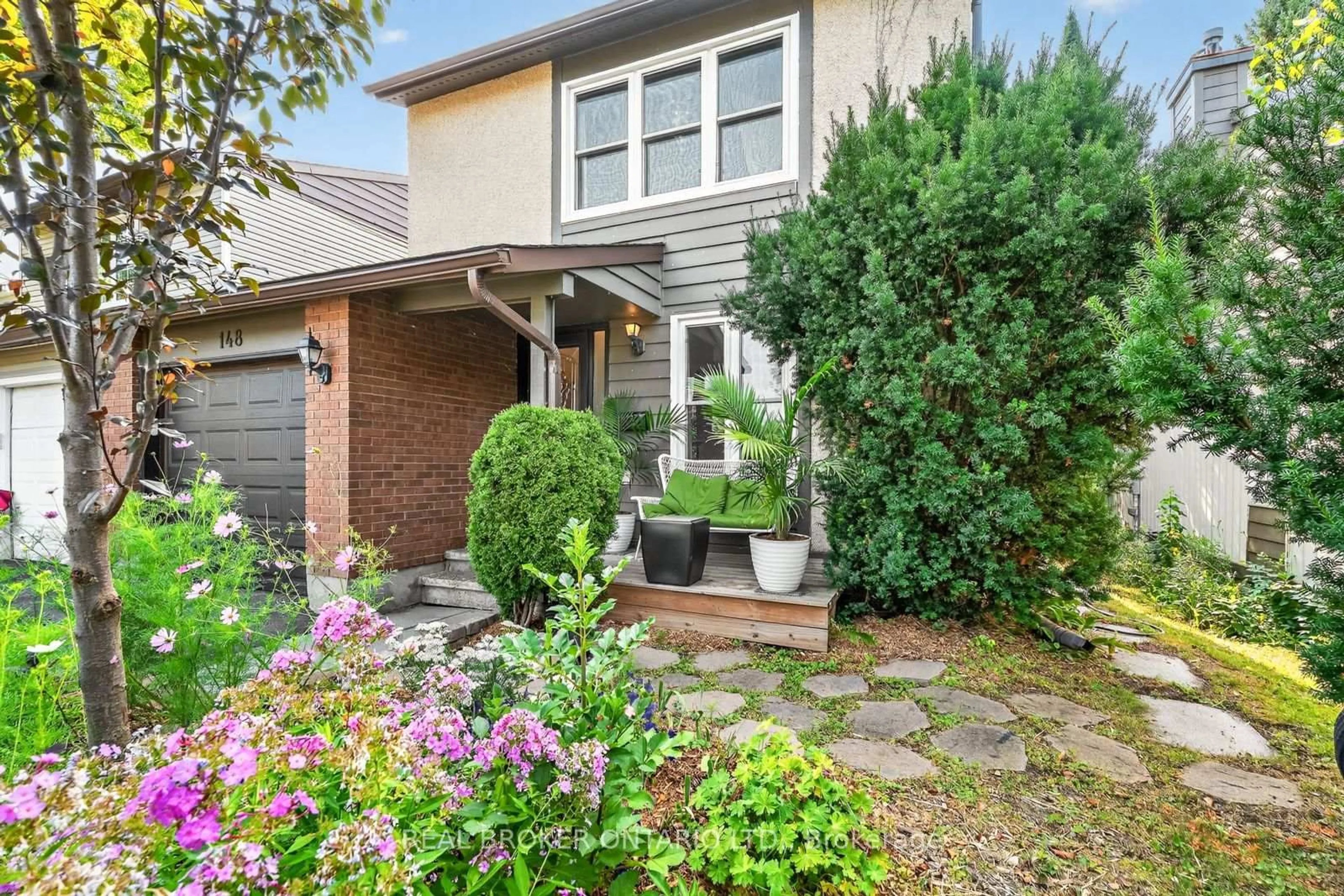 Home with brick exterior material, street for 148 Burnett's Grove Circ, Ottawa Ontario K2J 1S9