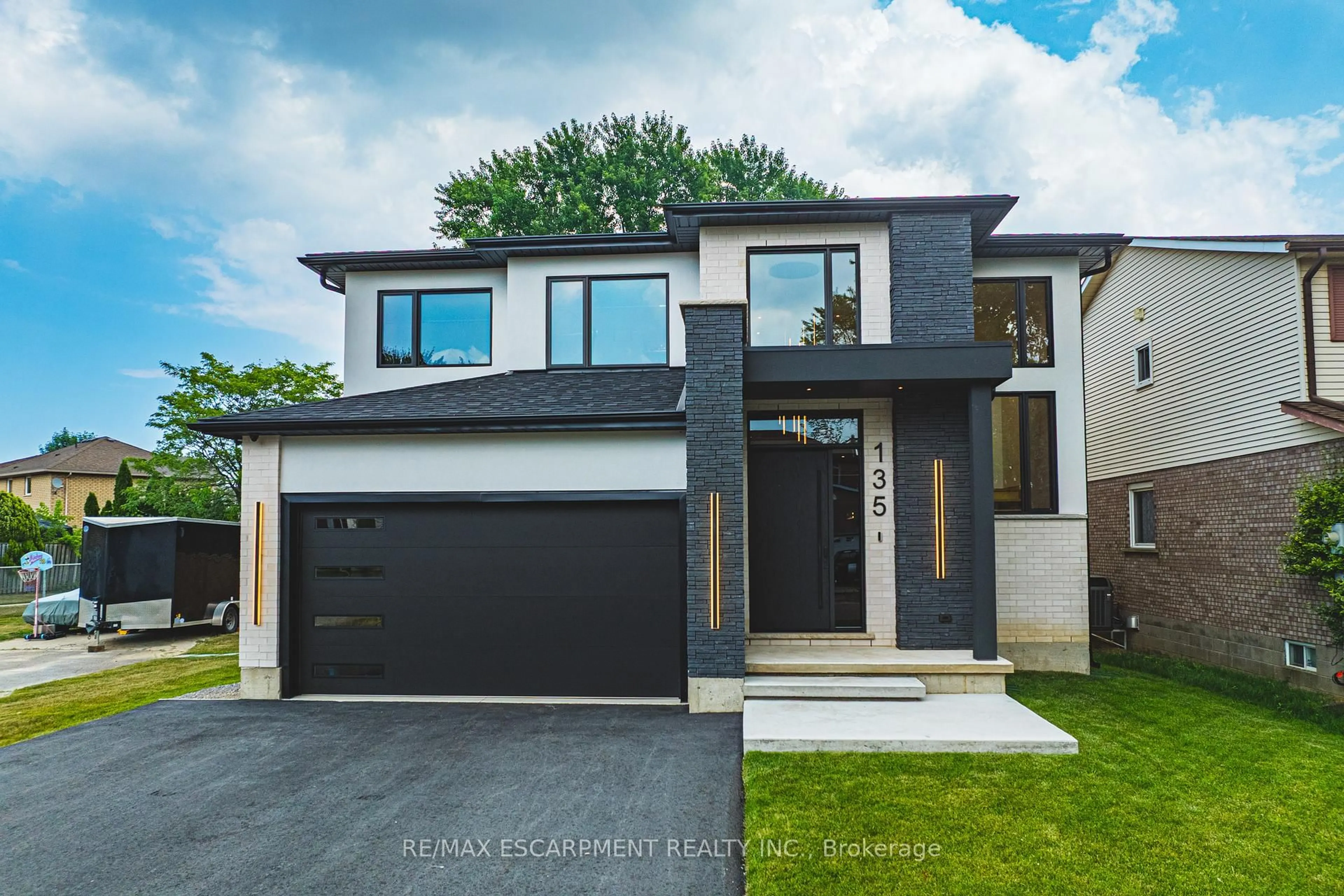 Home with brick exterior material, street for 135 Eleanor Ave, Hamilton Ontario L8W 1C7