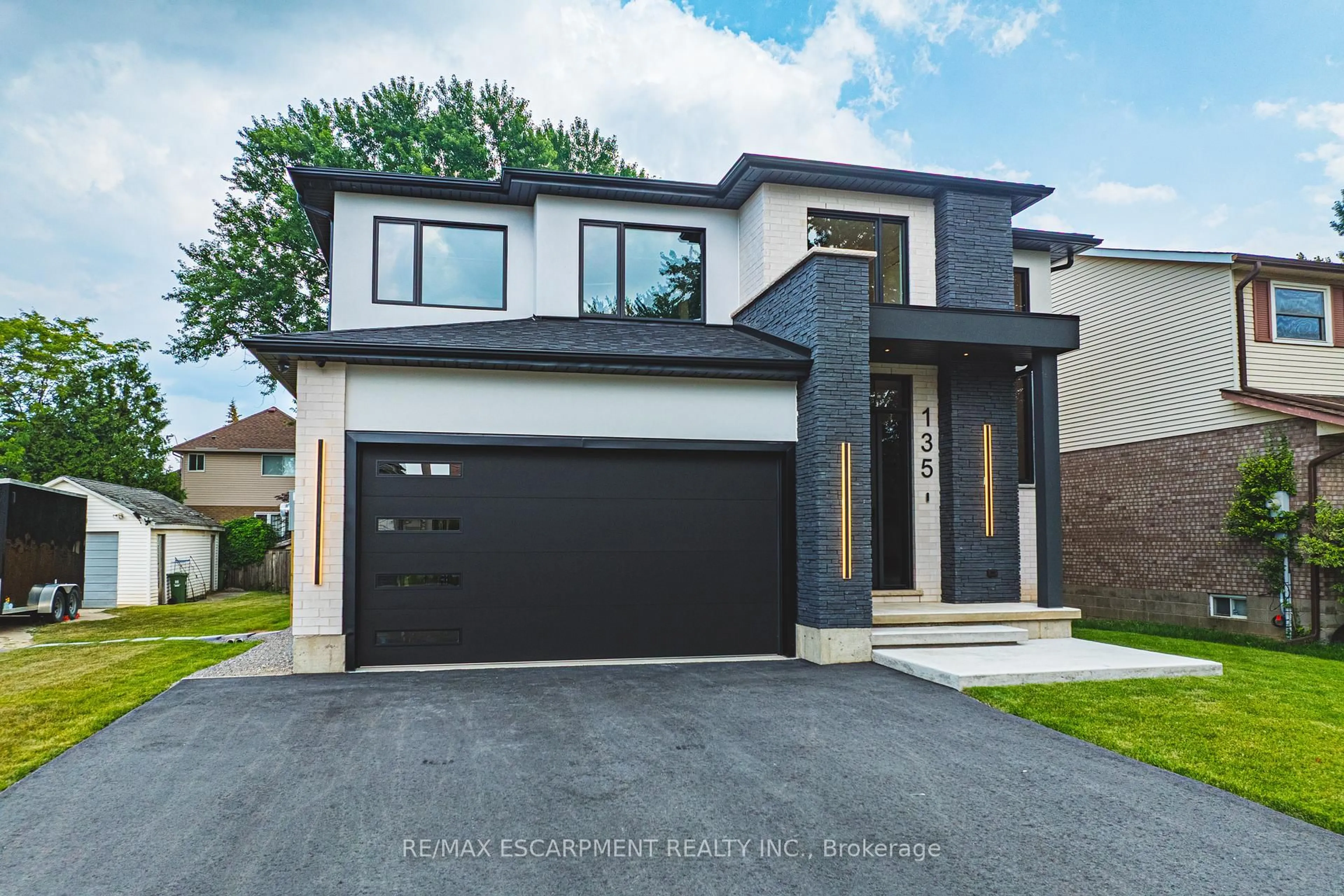 Home with brick exterior material, street for 135 Eleanor Ave, Hamilton Ontario L8W 1C7
