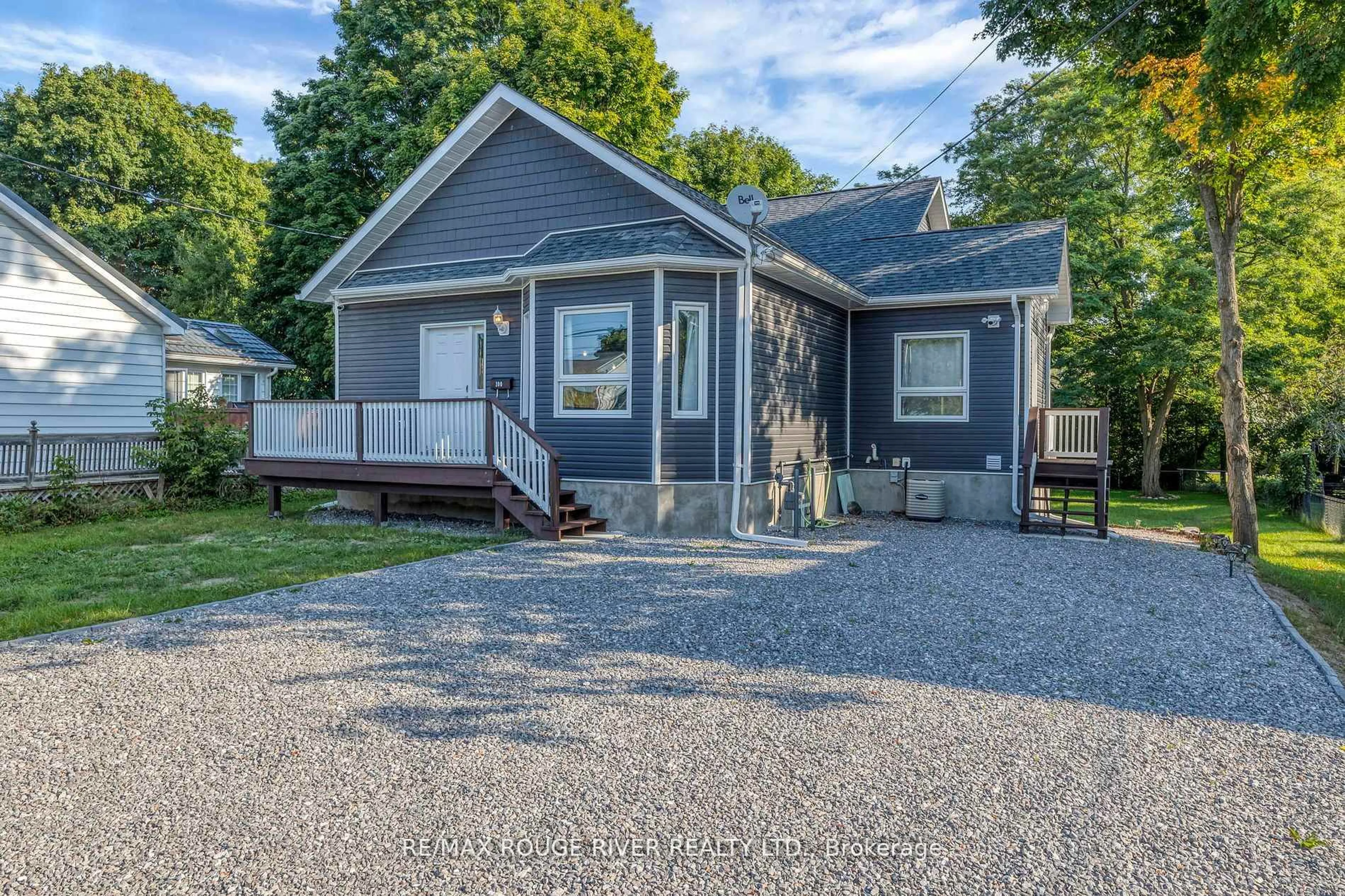 Home with vinyl exterior material, street for 100 Queen St, Kawartha Lakes Ontario K0M 1N0