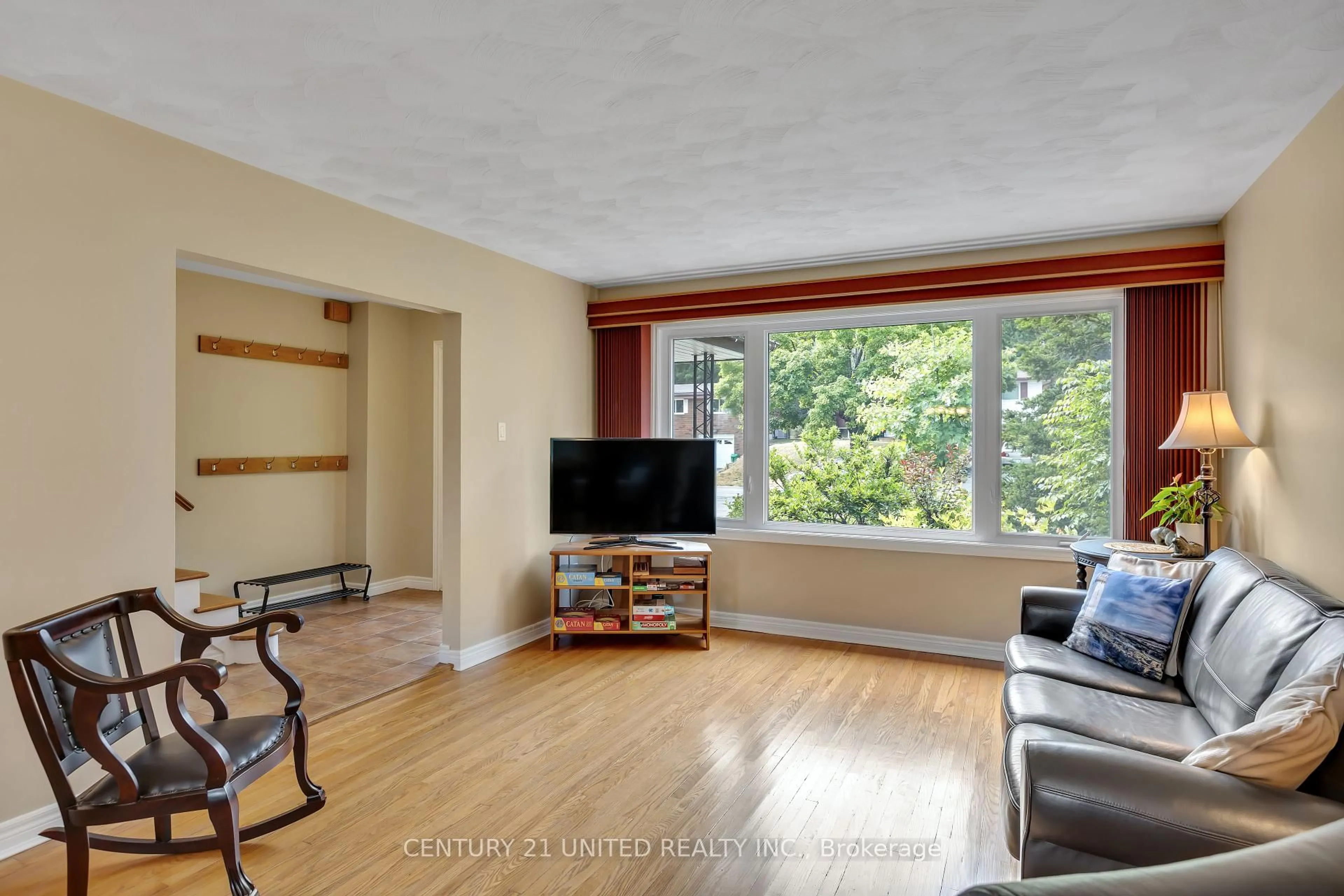 Living room with furniture, wood/laminate floor for 1296 Edmison Dr, Peterborough North Ontario K9H 6V3